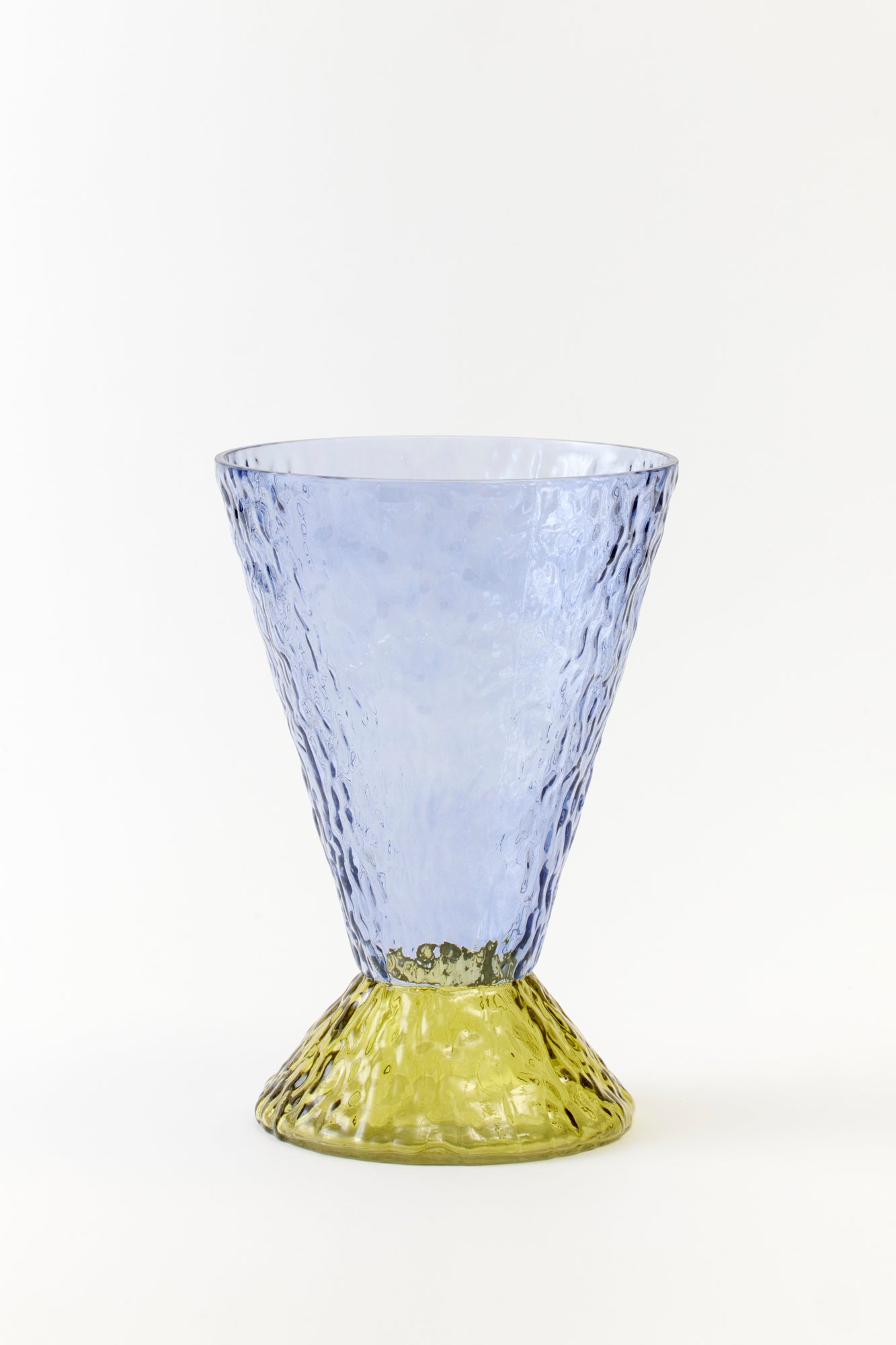 Striking blue textured glass with a unique, hammered design and a statement-making yellow-green base. The perfect blend of minimalism and bold style for a trendy, fashion-forward home aesthetic.