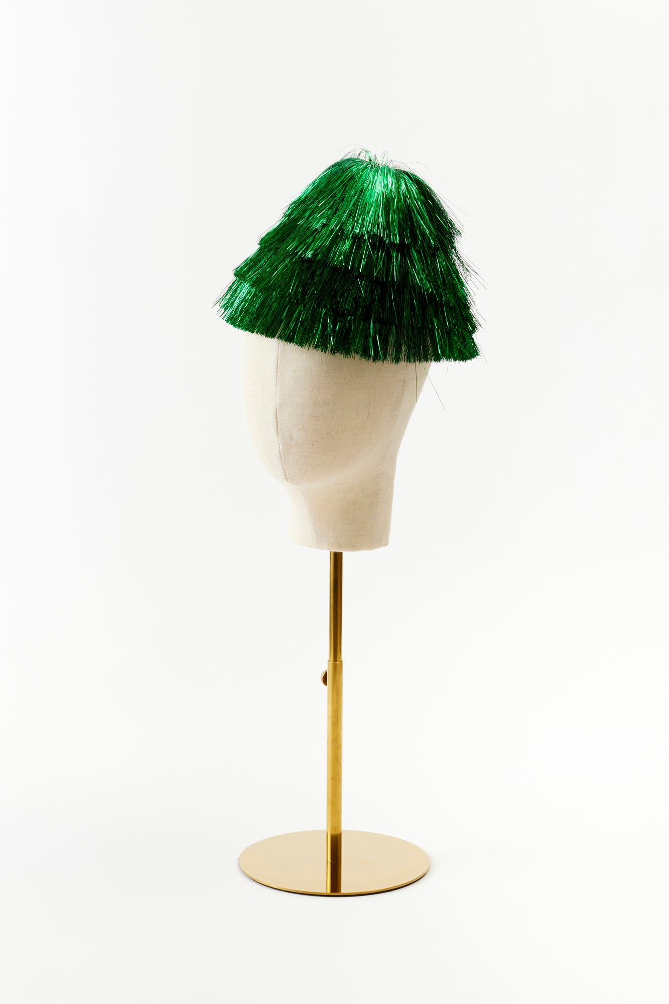 Green tinsel hat. Perfect for a Christmas party.