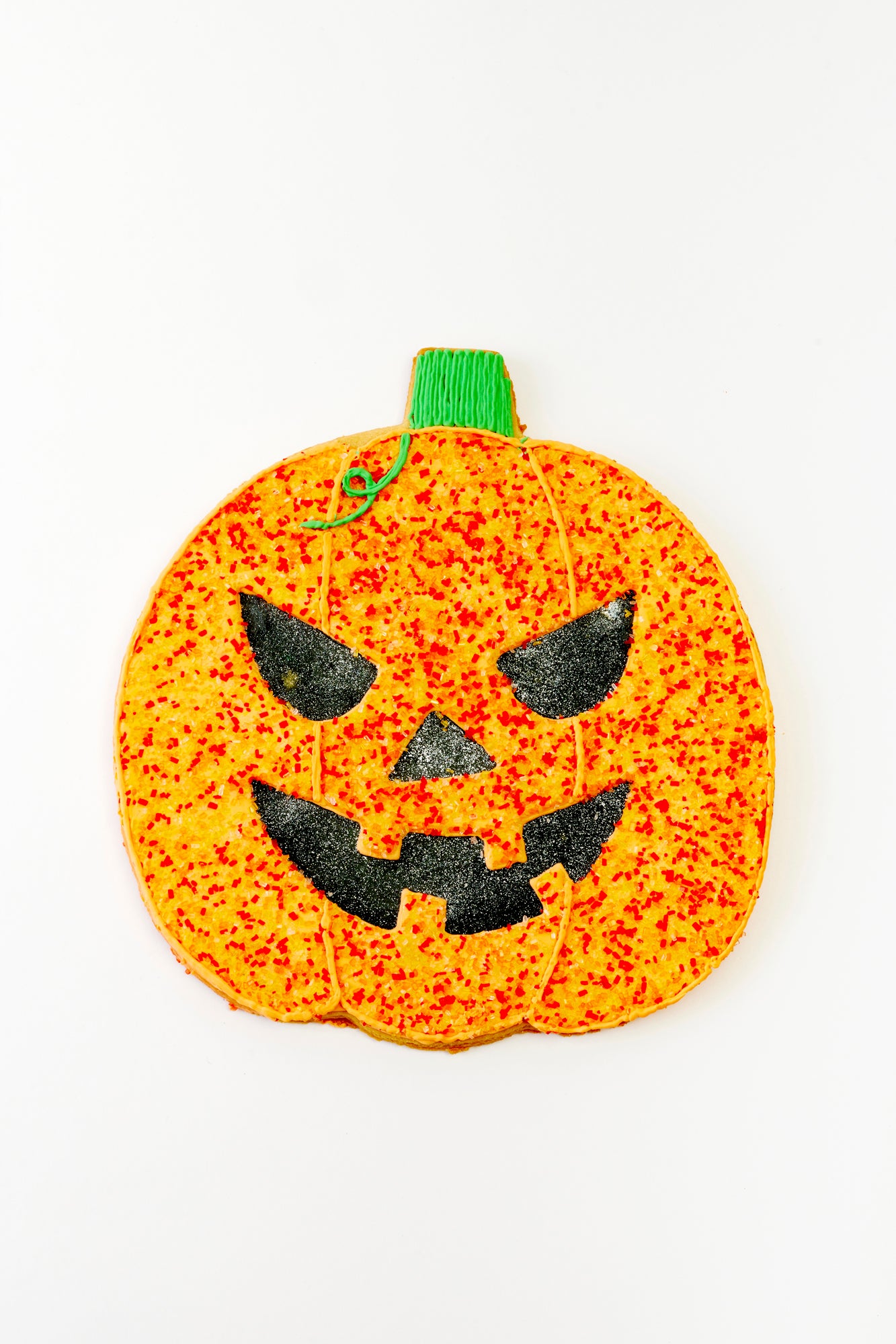 Giant Jack-o-lantern or pumpkin cookie. Classic Halloween for a sweet tooth.