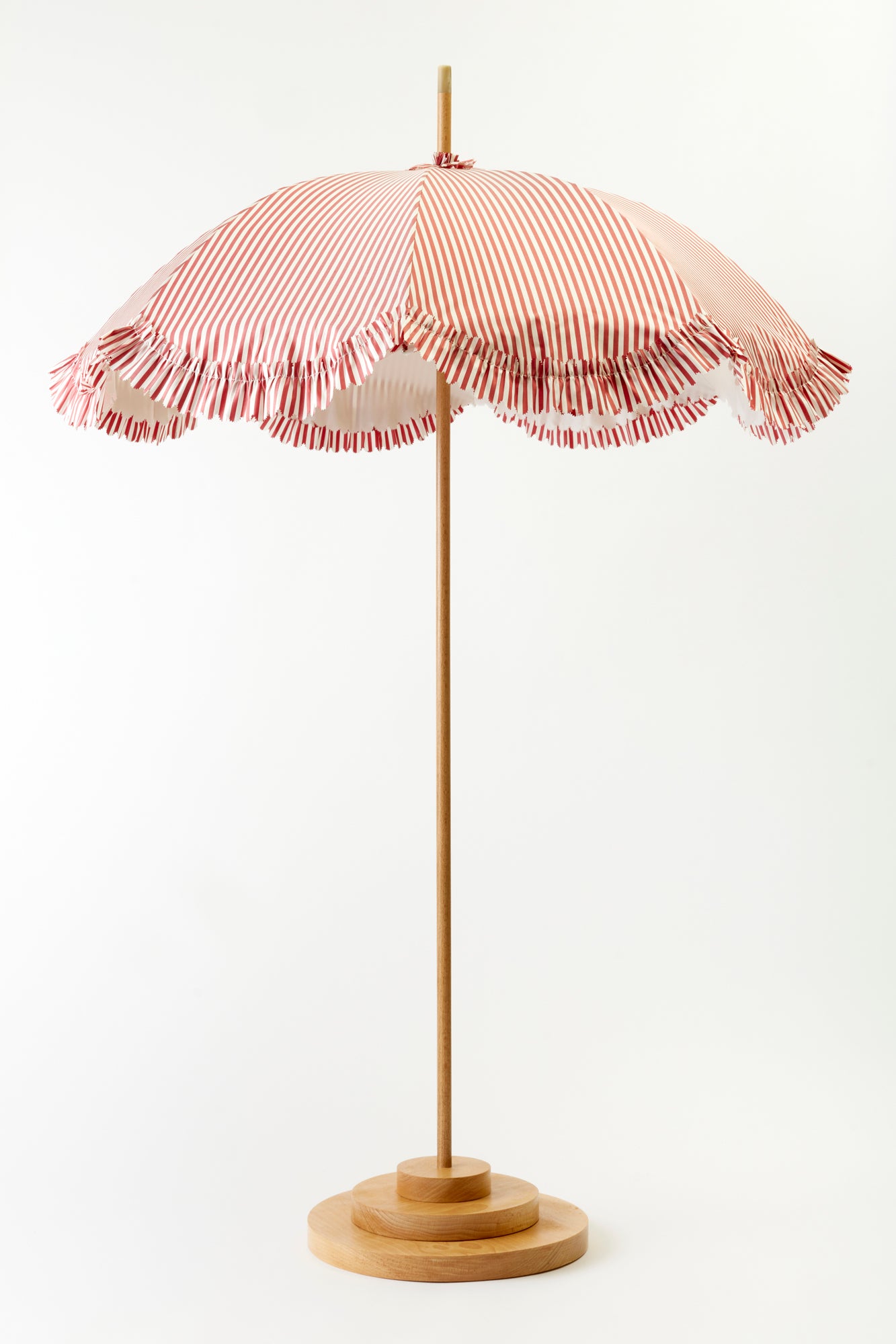 Umbrellas made in a Paris atelier with trim hand cut and sewn.