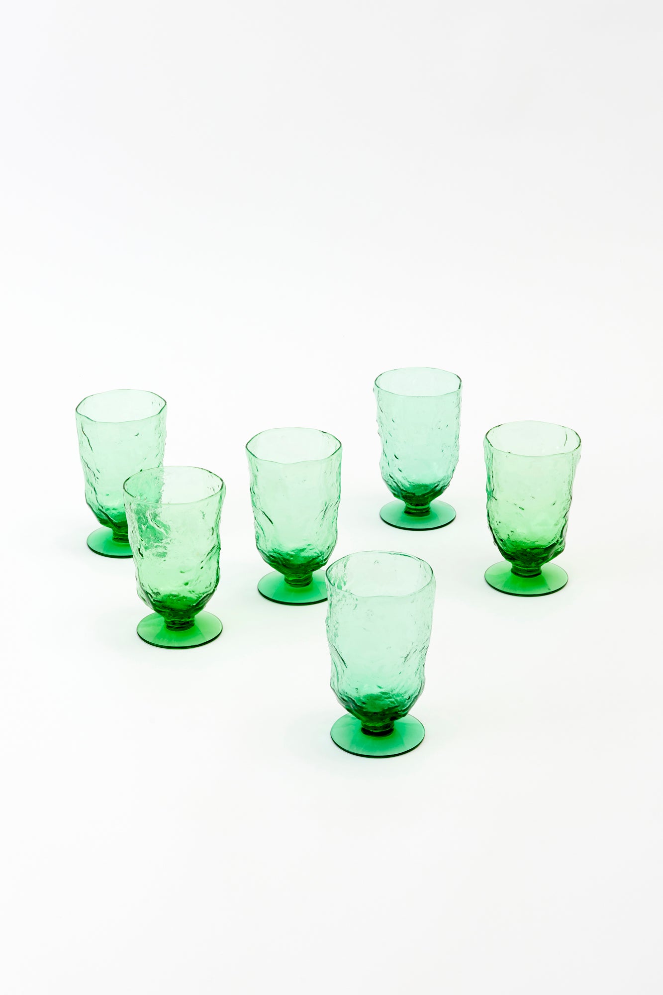 Set of six textured vintage glass goblets for wine or water.