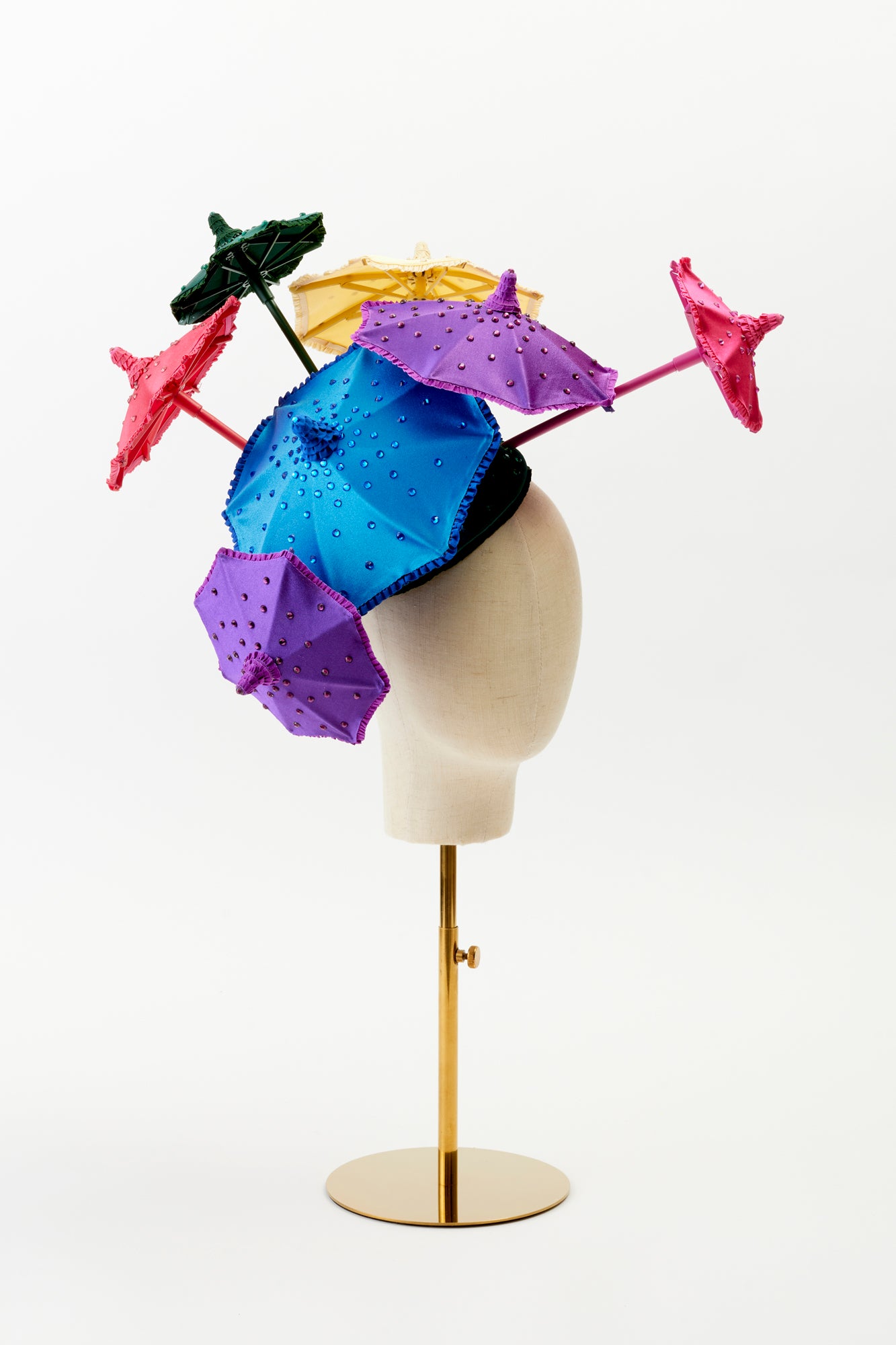 Show stopping colorful umbrella hat.