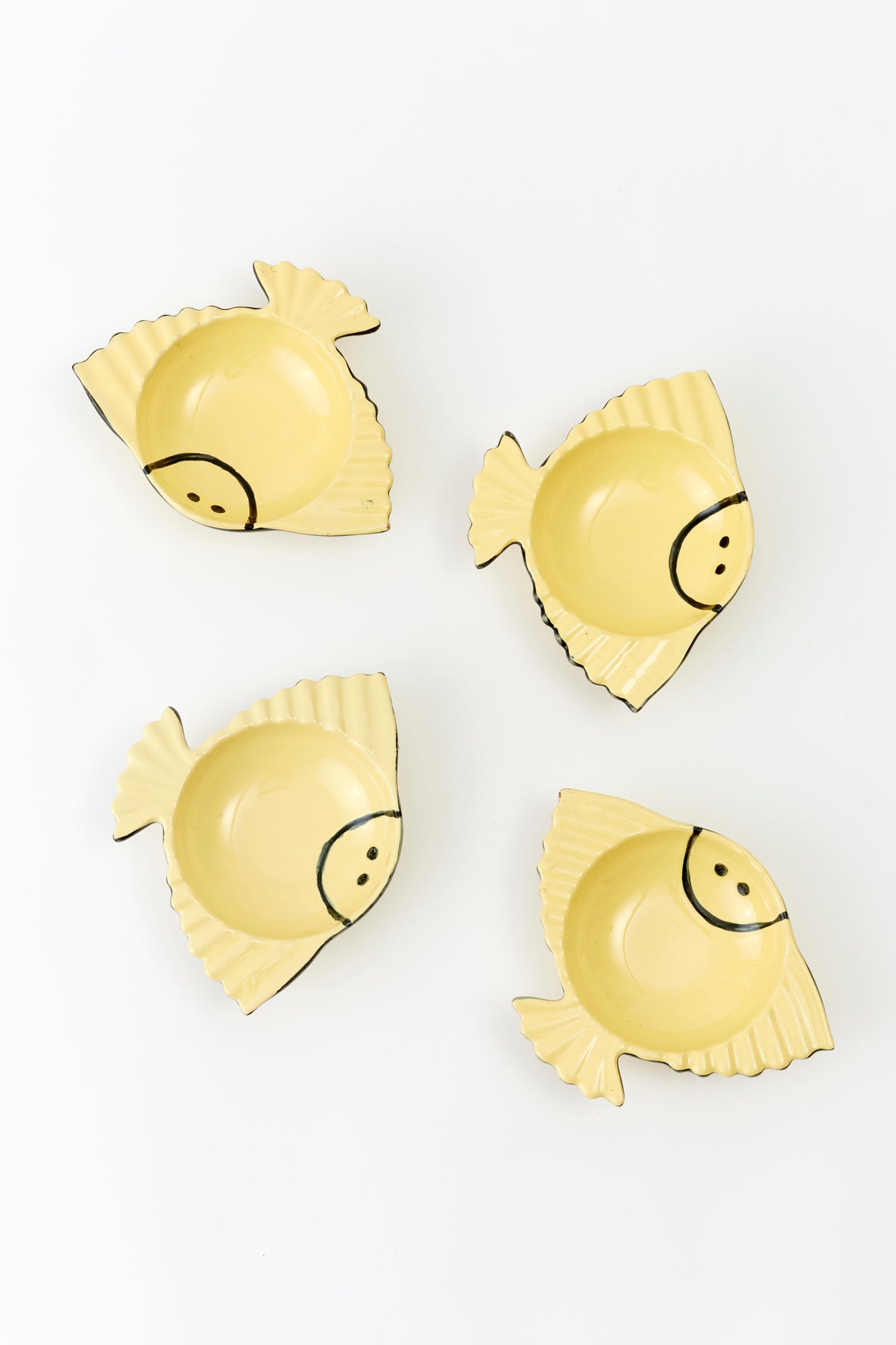 Yellow smiling fish bowls.