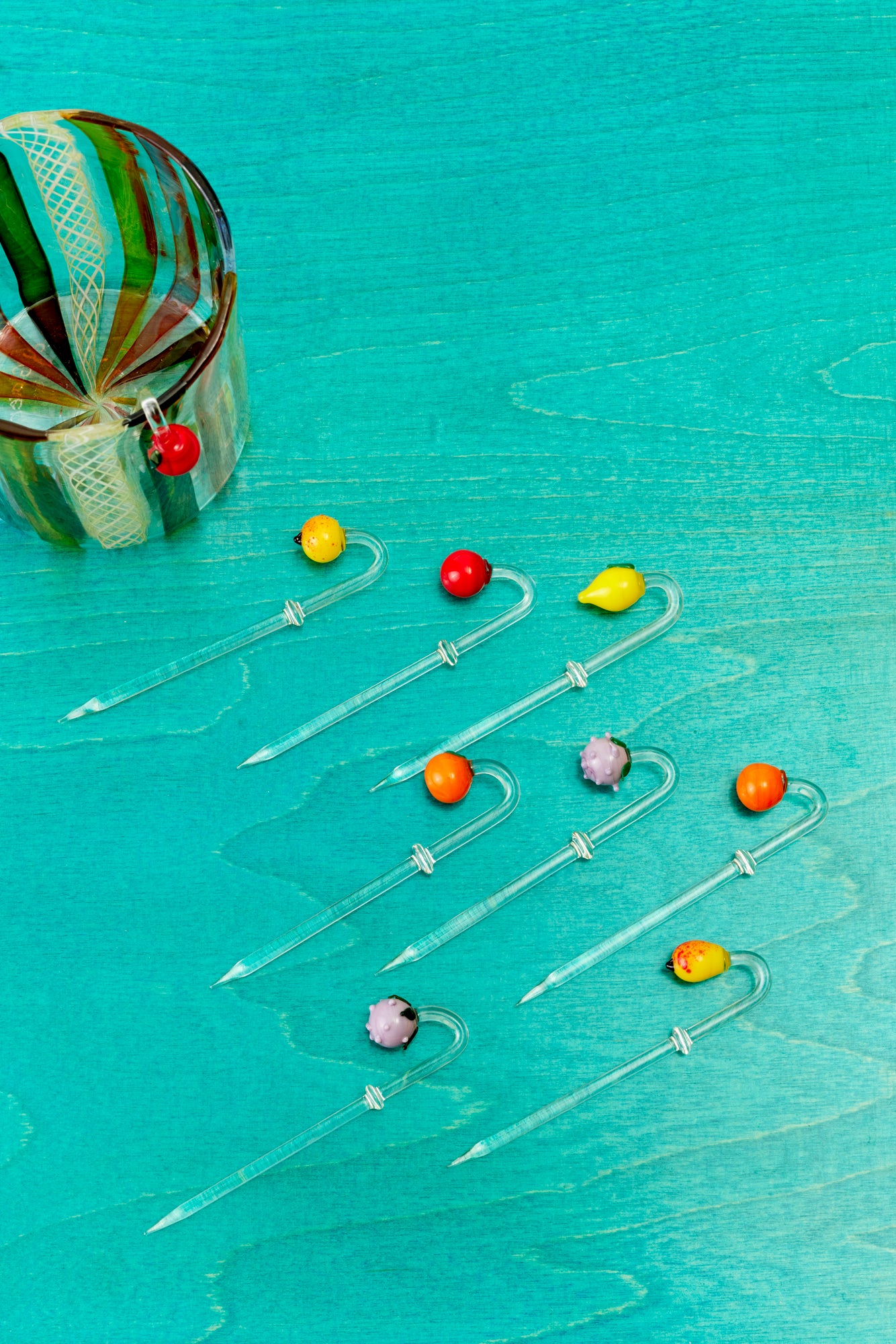 Cocktail picks with colorful fruits.