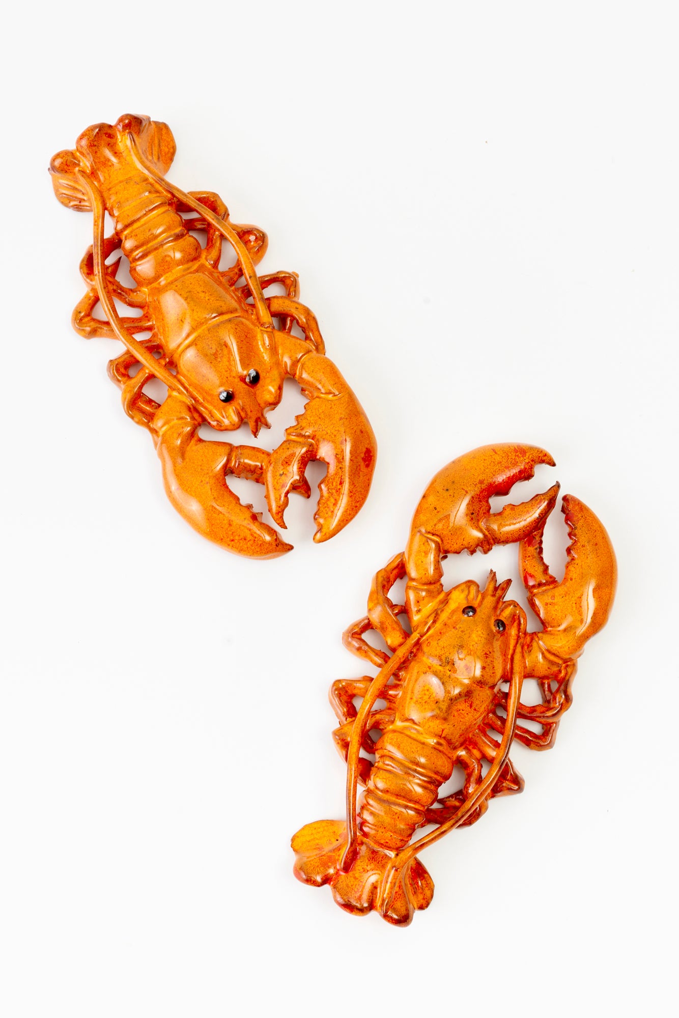 Ceramic orange lobsters.