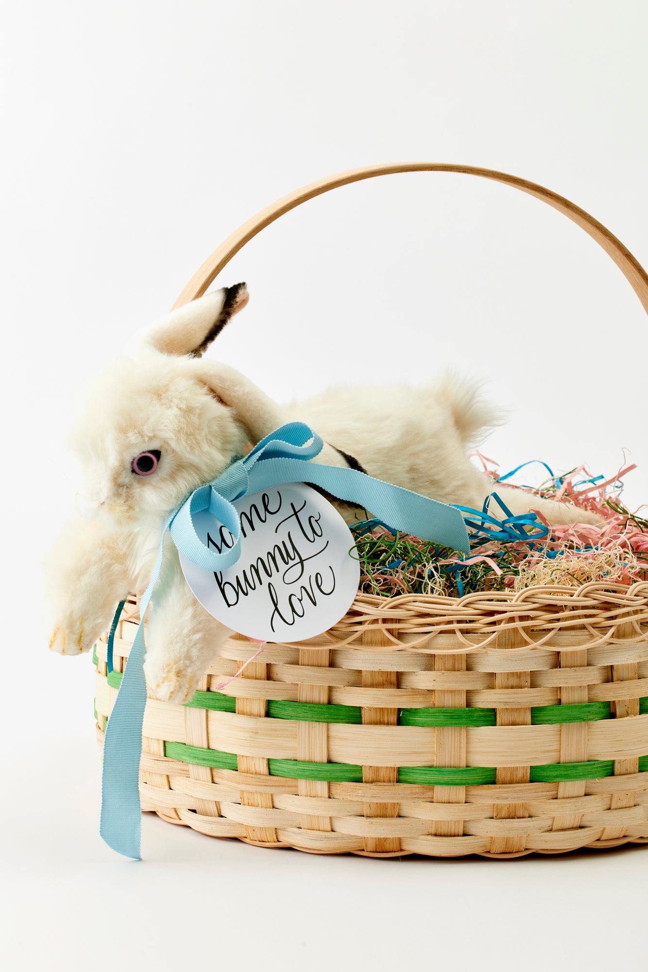 Handwoven easter basket with stuffed bunny.