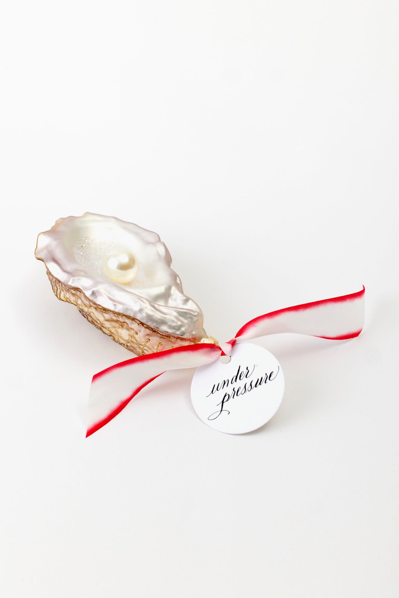 Oyster with pearl ornament.