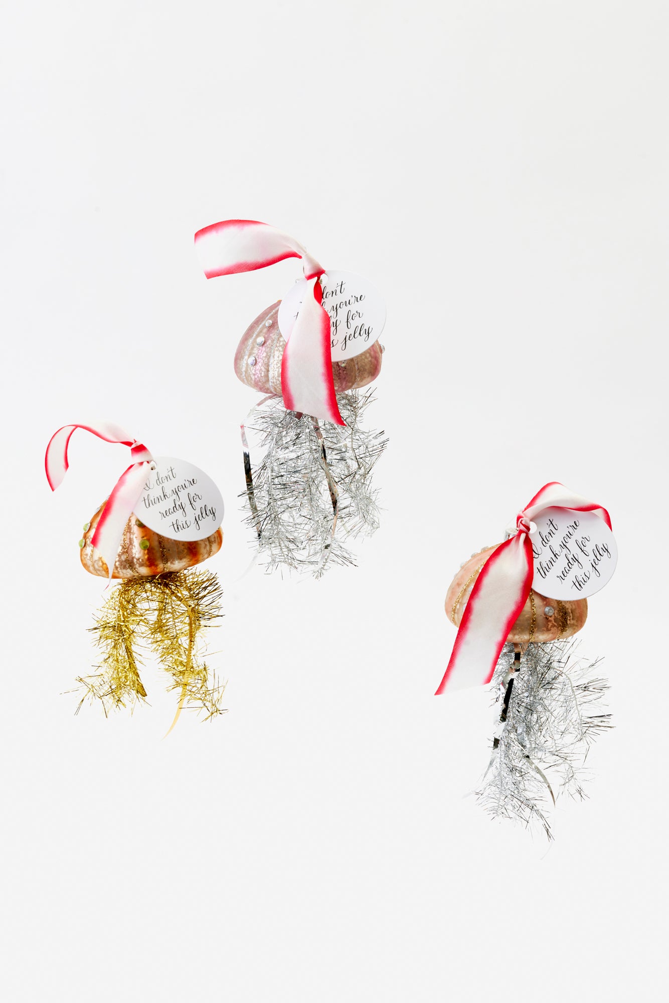 Set of three jellyfish with tinsel tentacles.