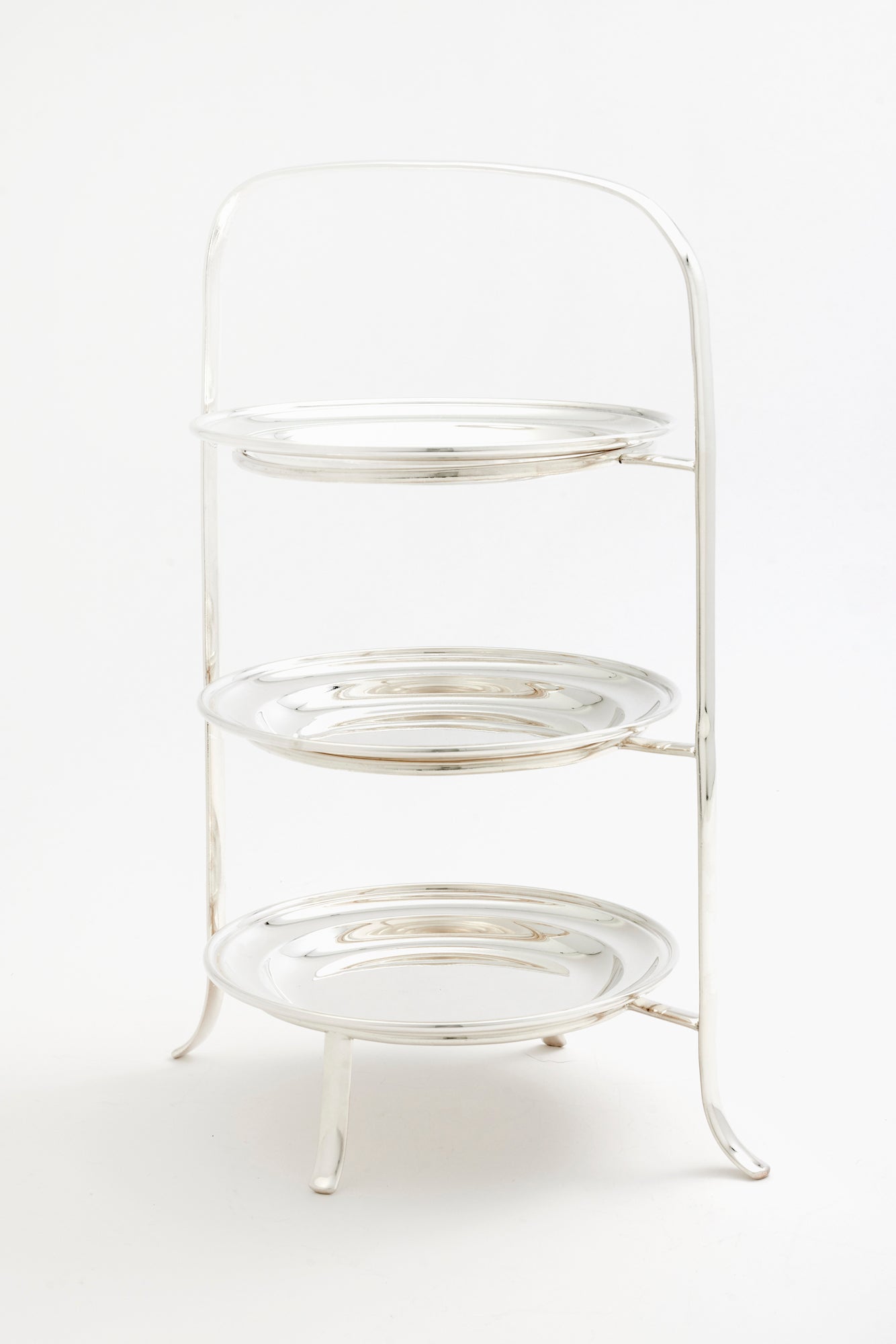 Silver tea stand with plates.