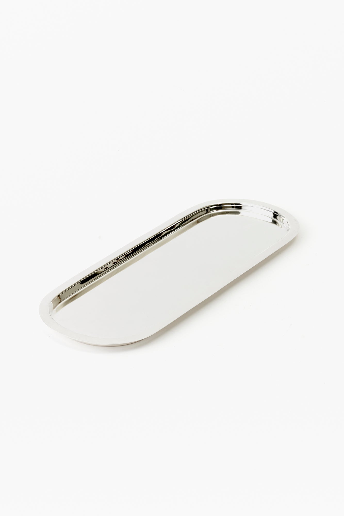 Oblong simple silver tray is an elegant solution for serving tea sandwiches.