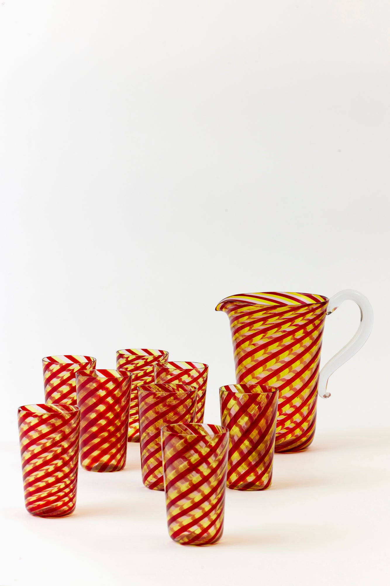 Candy striped tumblers with matching pitcher.