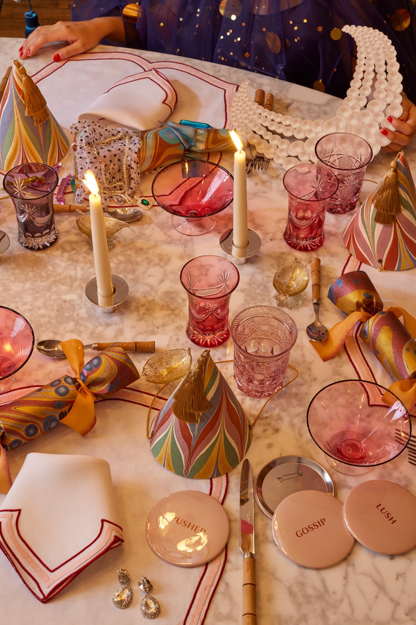 Crimson and crepe colored linen dinner napkin in an unusual scalloped design with embroidery and French stitch appliqué made in Madeira, Portugal.