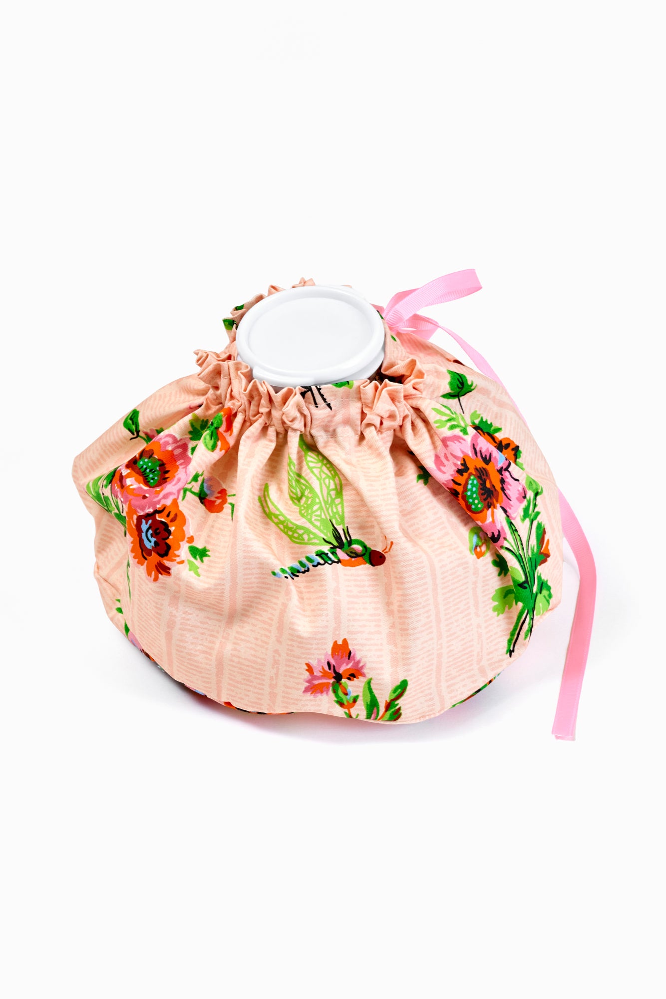 Pink chintz floral-patterned ice pack cover with a pink ribbon on a white background.