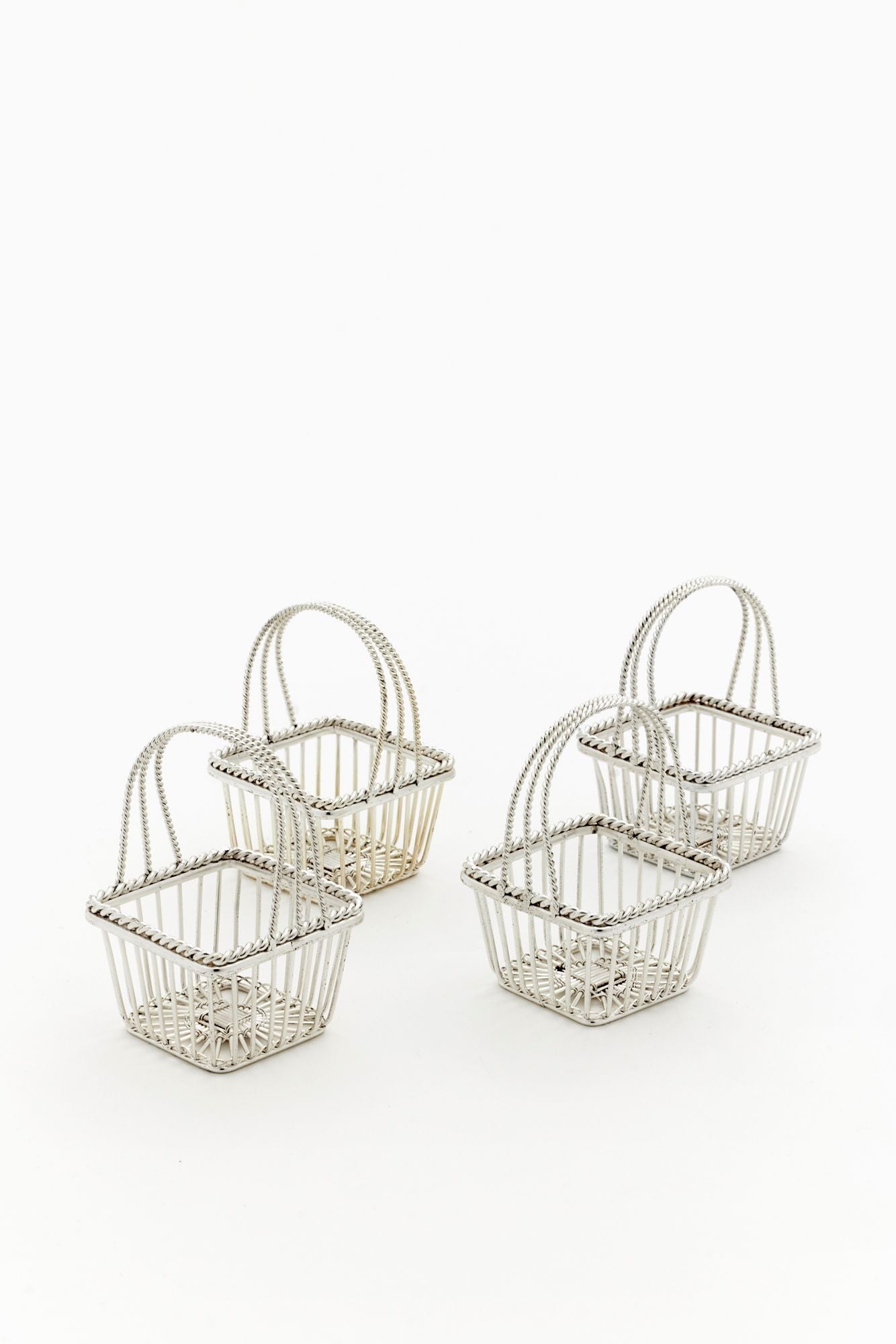 SET OF 4 VINTAGE PETITE SQUARE SILVER BASKETS.