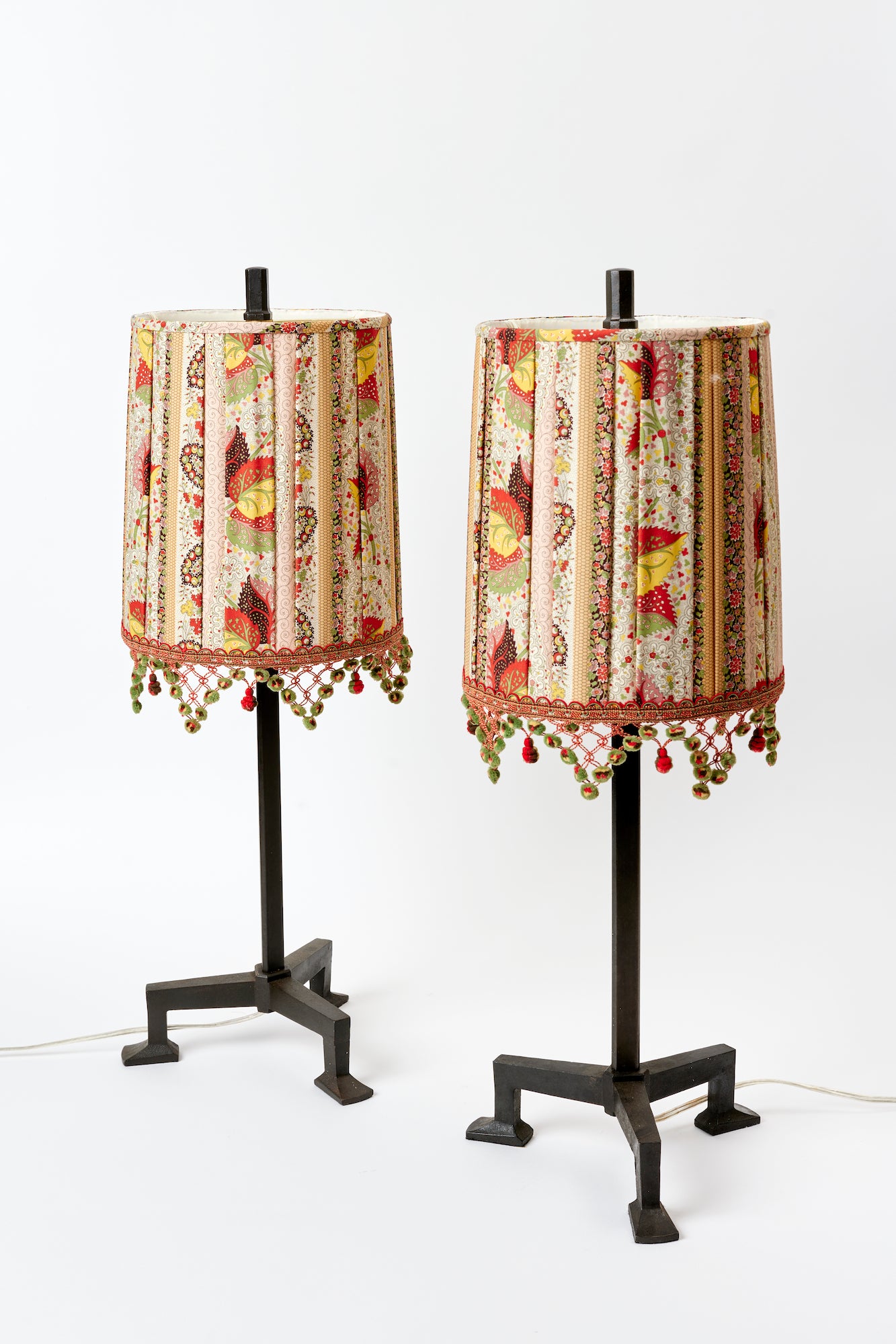 This pair of iron table lamps features shades made in Decors Barbares' Casse Noisette fabric with antique French passementerie.