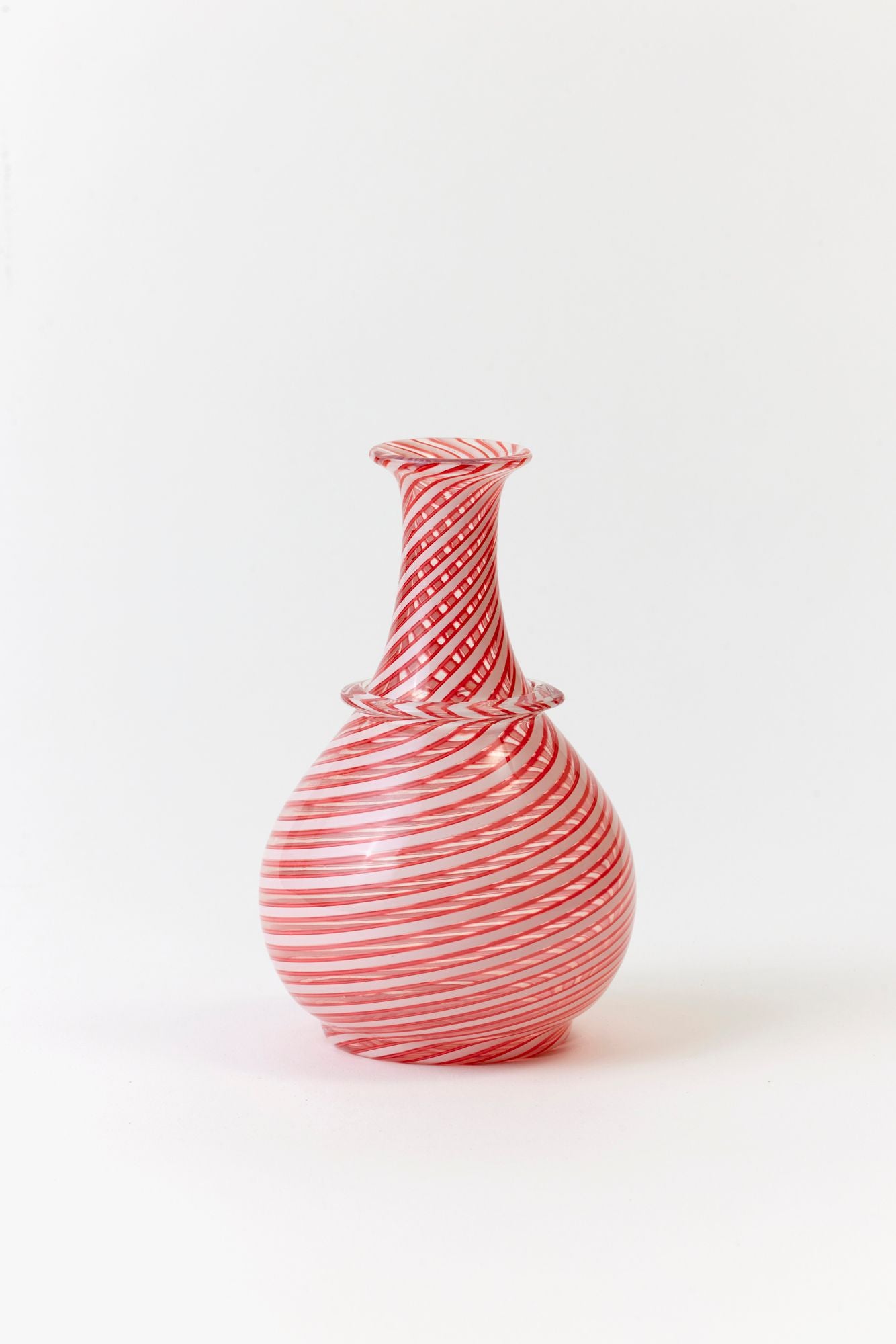 Red and white striped vase on a white background.