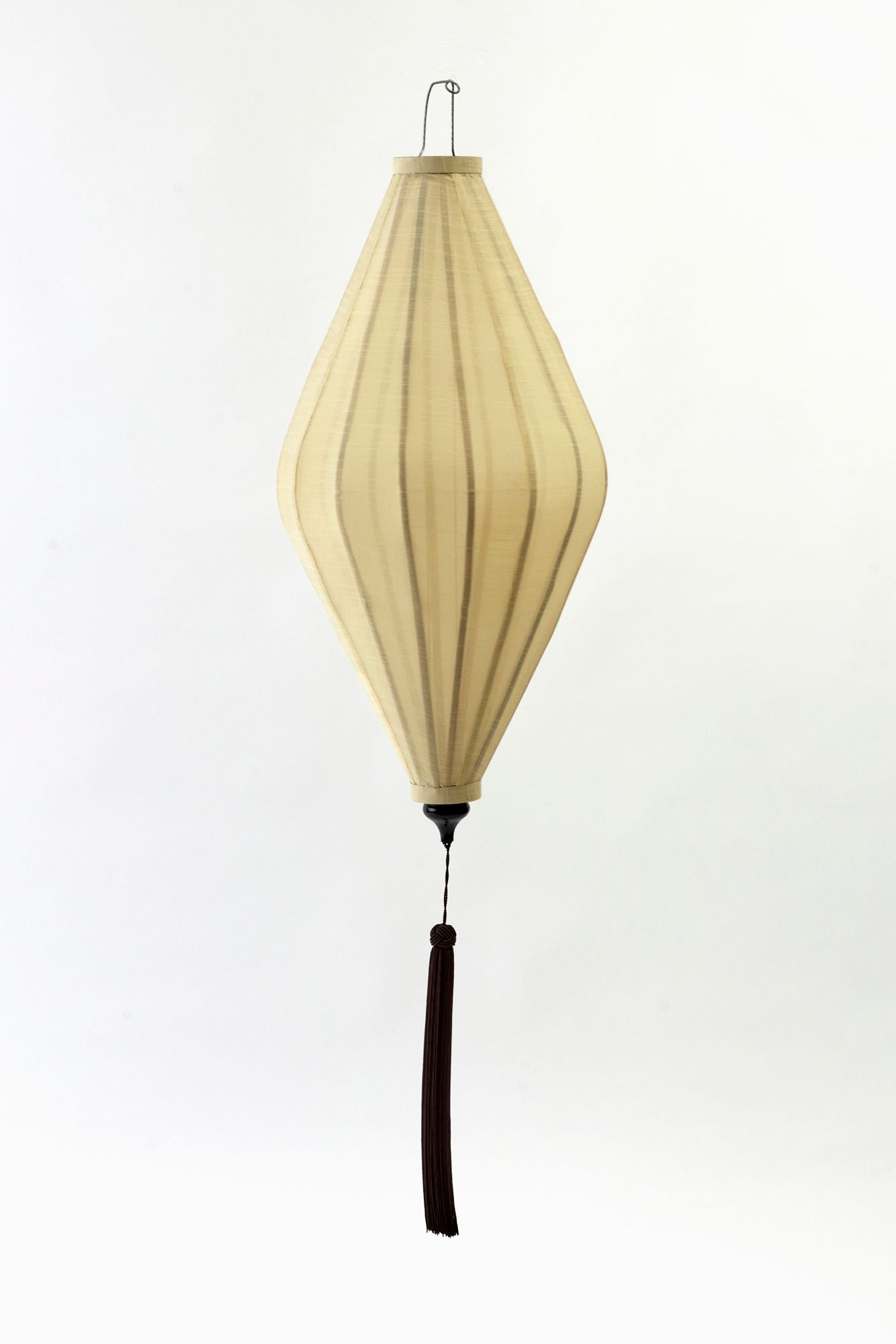 yellow lantern on white backdrop