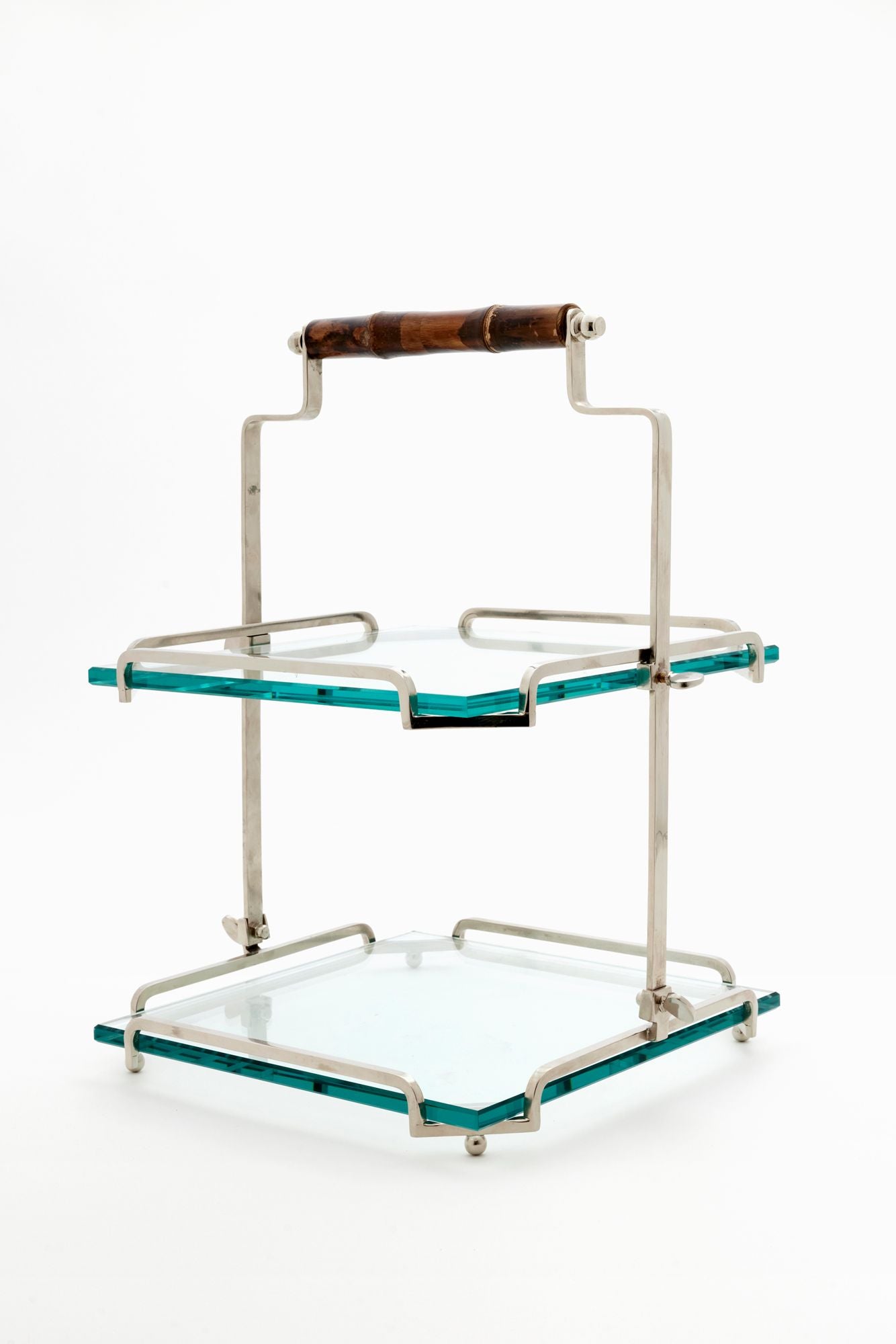 Two-tiered serving cart with glass shelves and wooden handle on a white background
