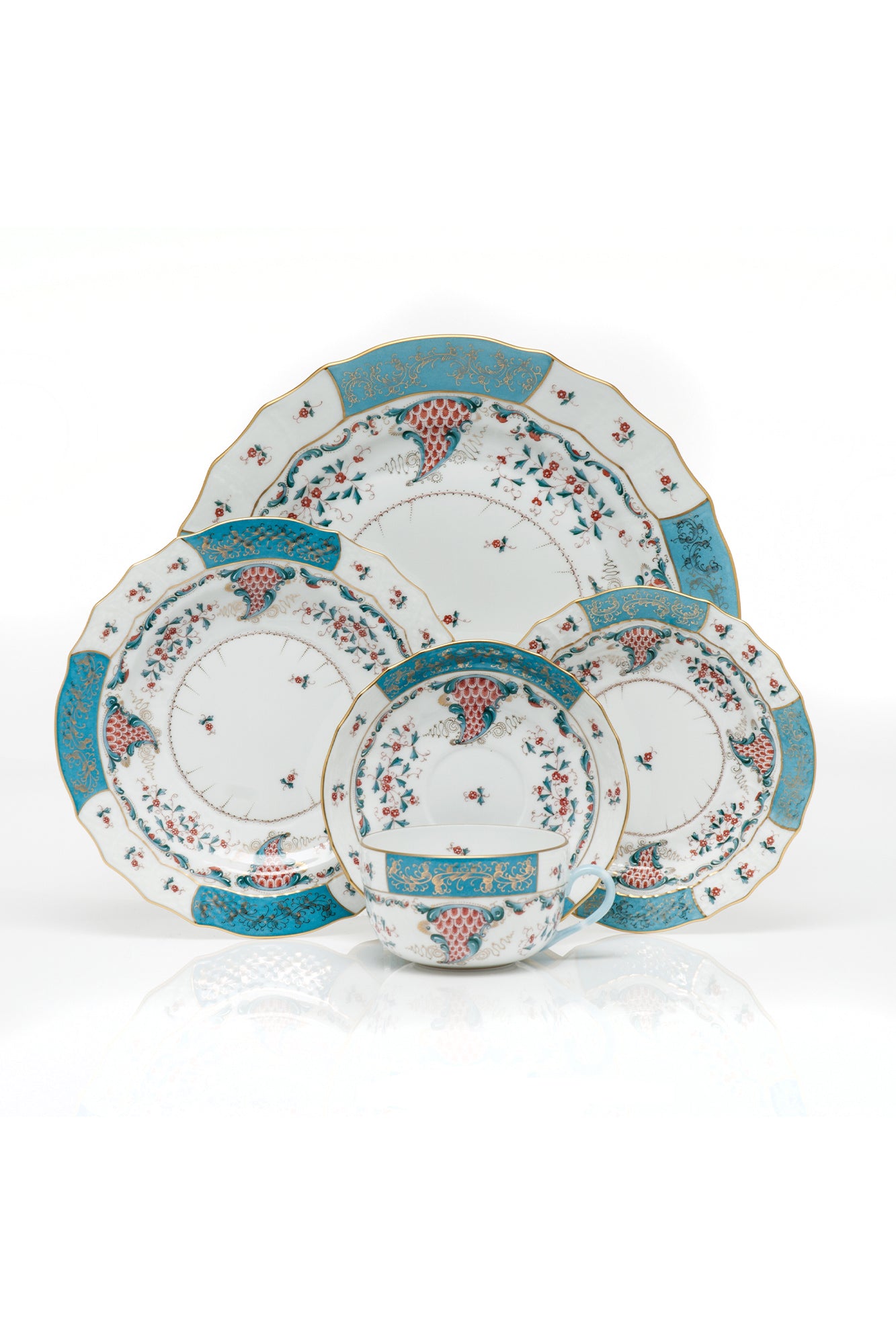 Herend Cornucopia porcelain setting. Five piece place setting includes dinner plate, dessert plate, bread & butter plate, and canton cup with saucer. Turquoise with 24k gold accents. 
