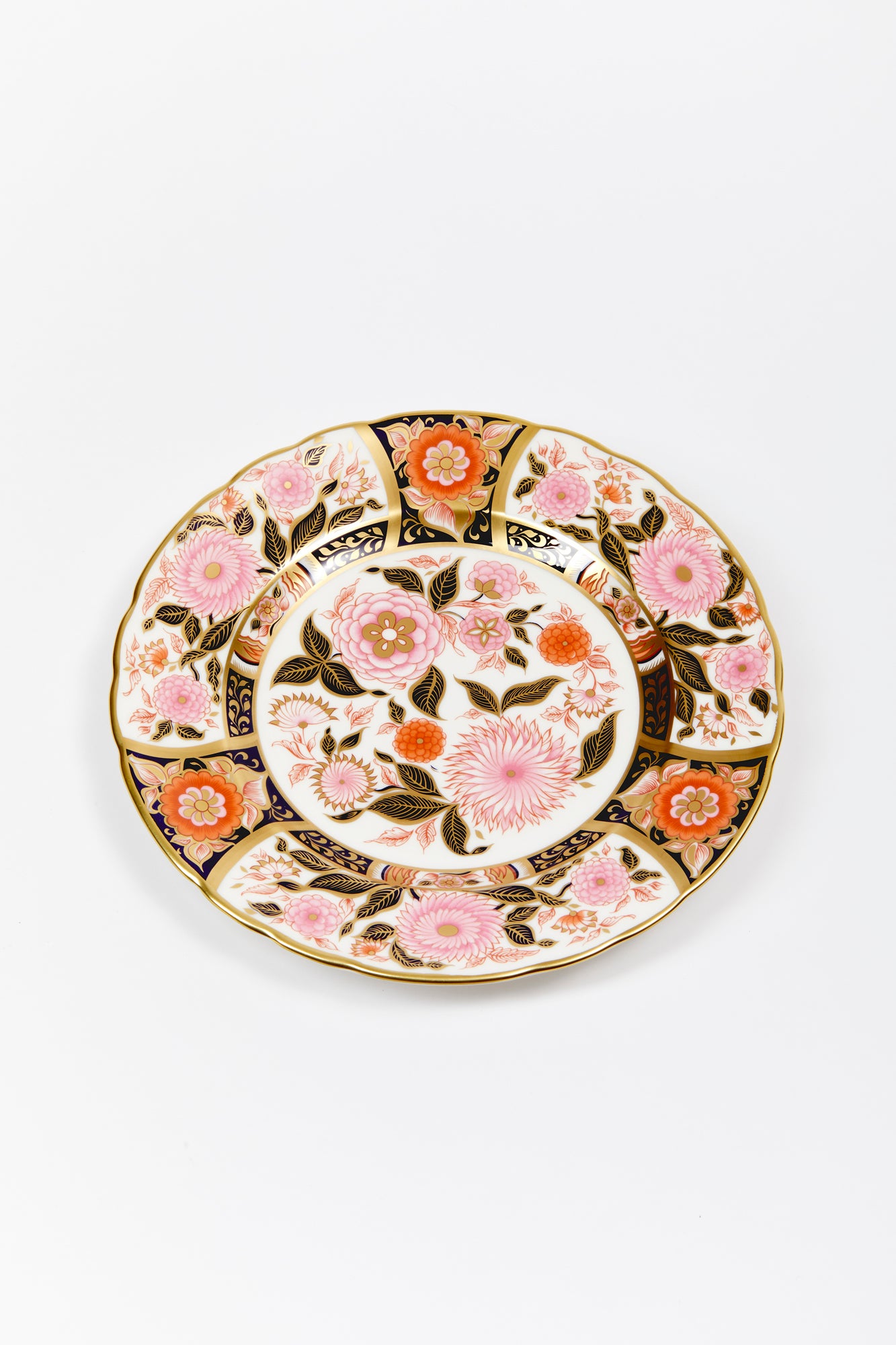 Handmade dinner plate and decorated in pink with 24k gold.