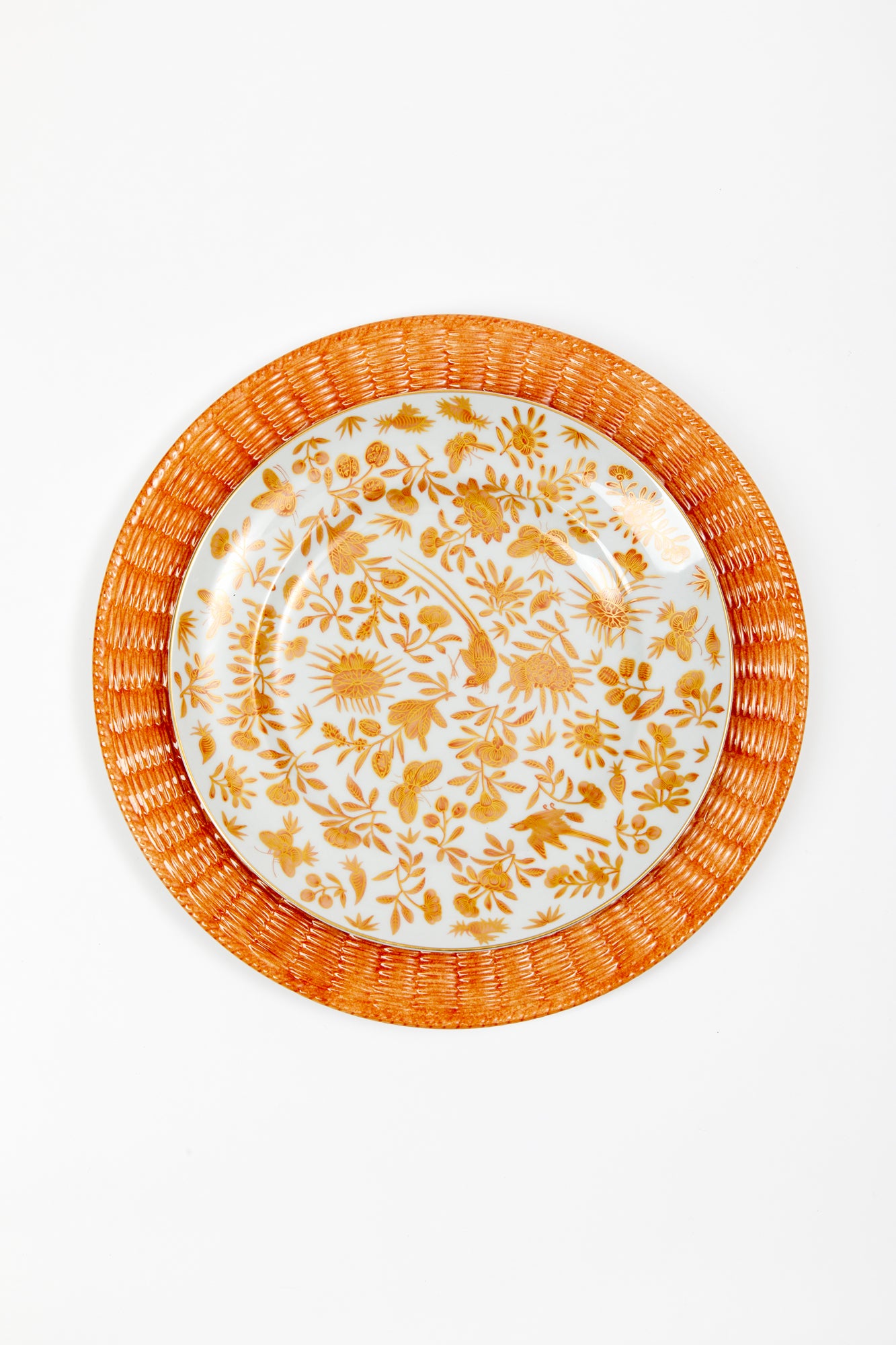 Orange ceramic wicker service plate.