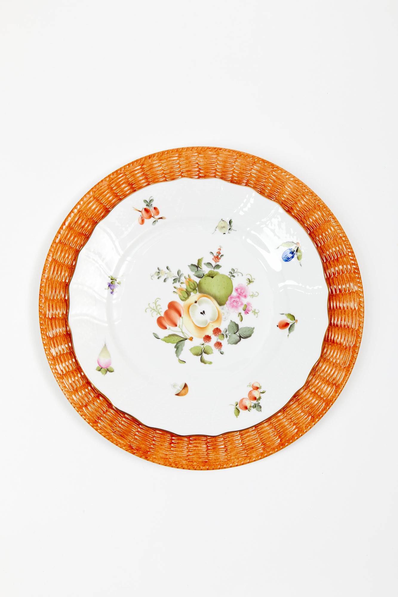 Orange ceramic wicker service plate.