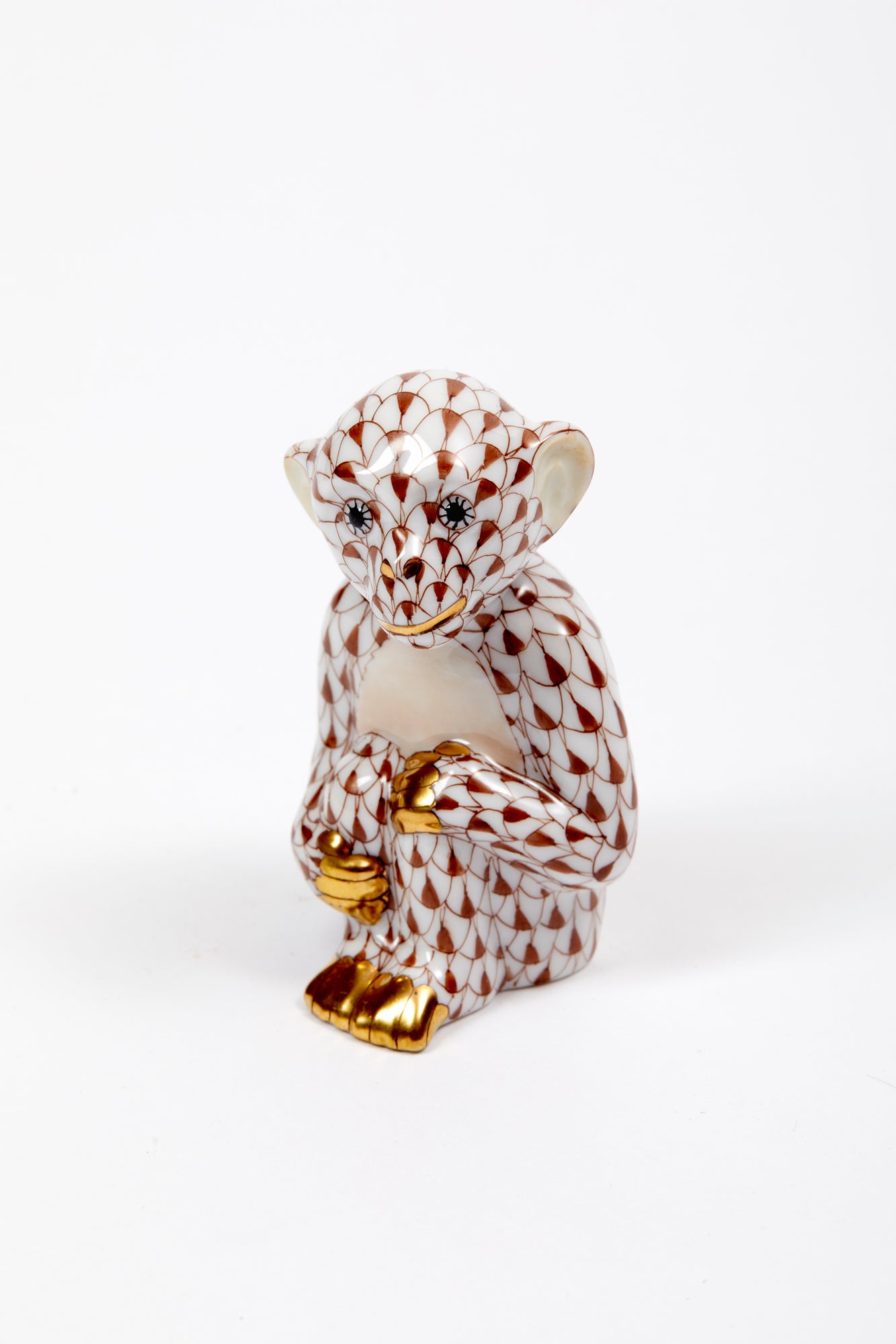 Handmade and hand-painted monkey in Hungary by Herend by master artisans. 24k gold accents.