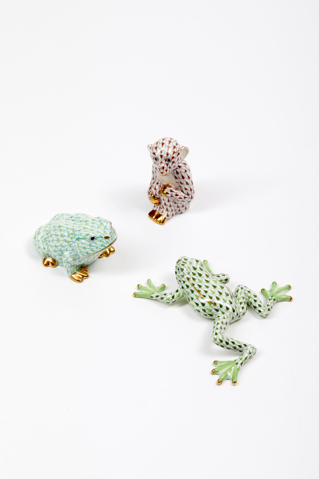 Handmade and hand-painted animals in Hungary by Herend by master artisans. 24k gold accents.