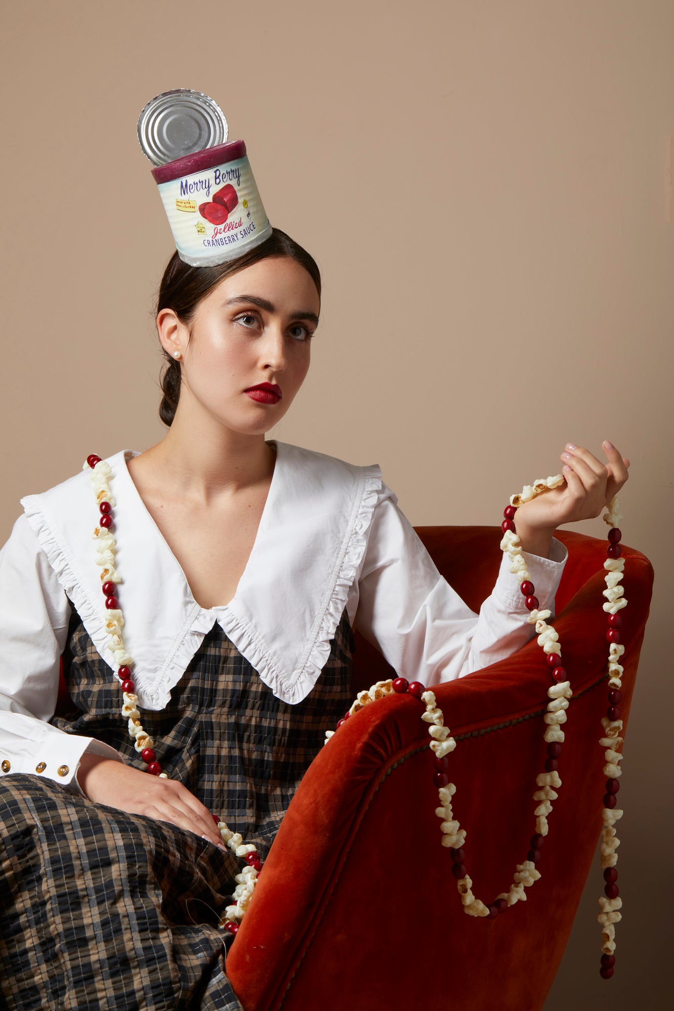 Girl wearing a cranberry can headband.