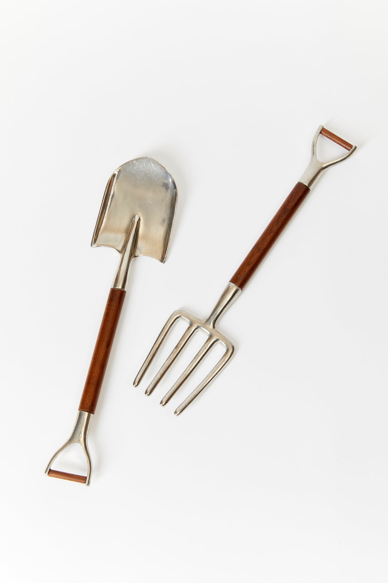 Salad utensils inspired by garden tools.