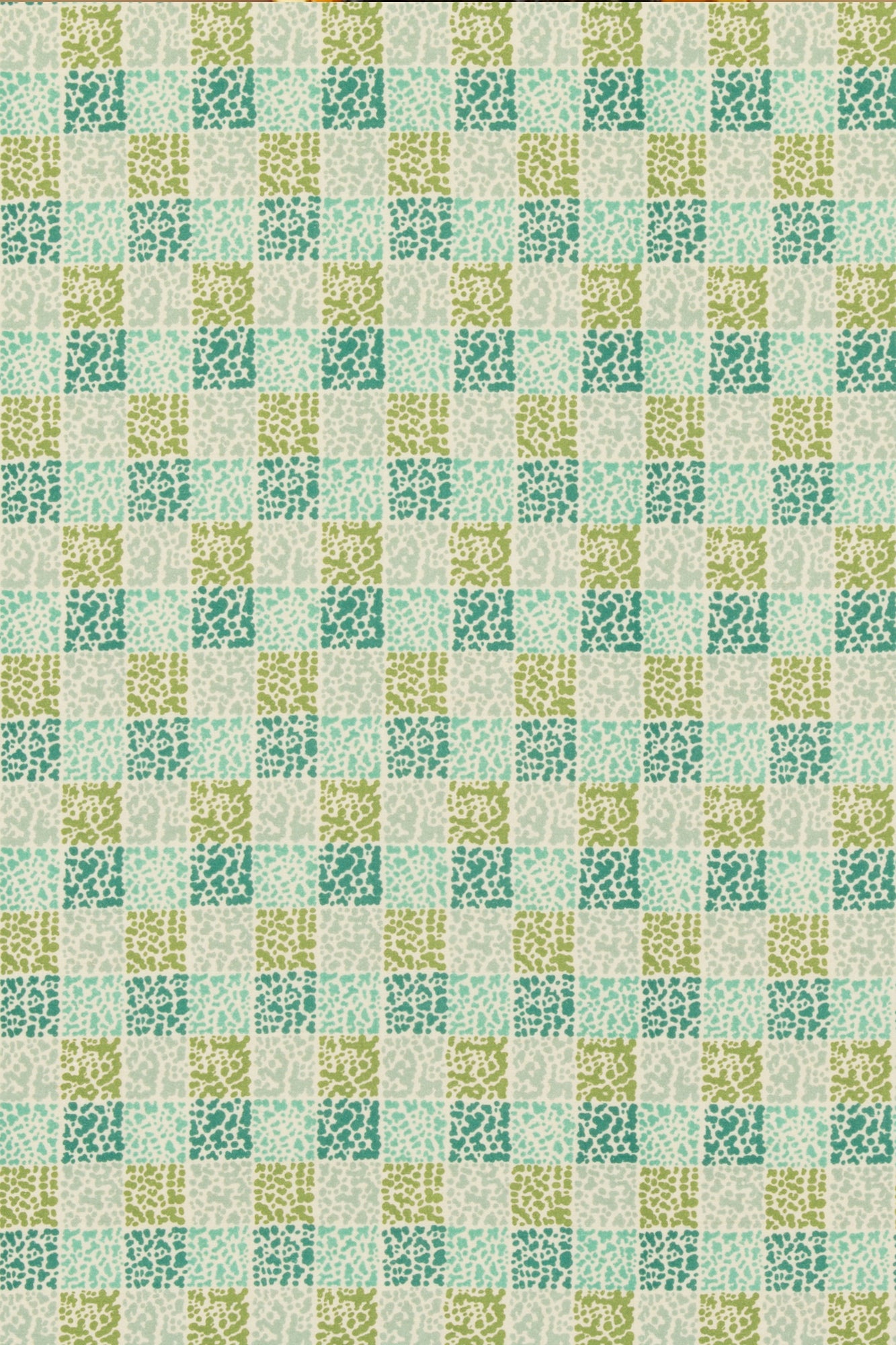 Tablecloth in “Dash Endive" linen by Lee Jofa. Designed by Kelly Wearstler, this post-modernized take on a traditional block print checkers lime and tourmalines for endless dinnerware pairings.