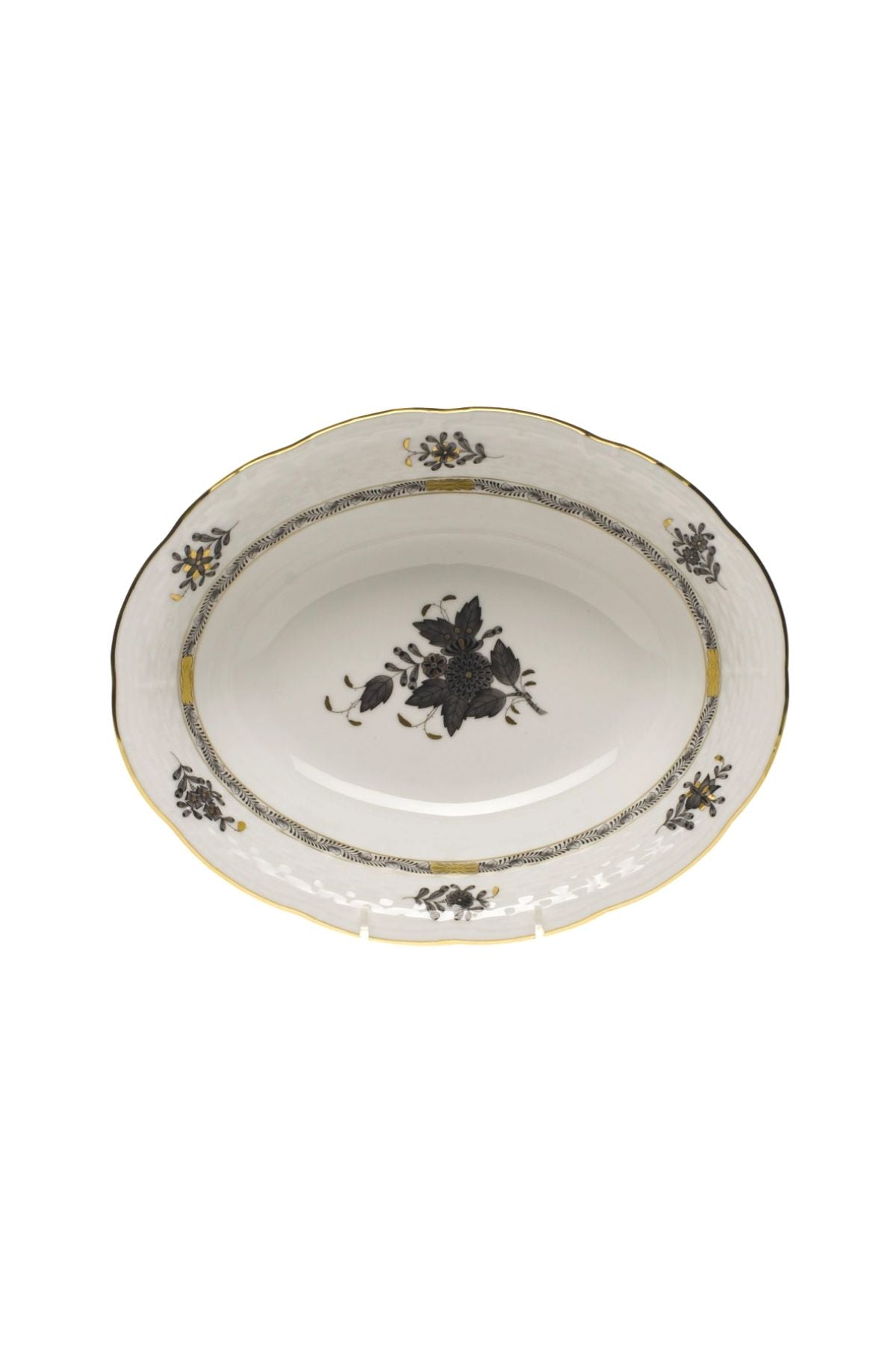 Five piece dinner service is hand painted on white porcelain including 24k accents. Black details.