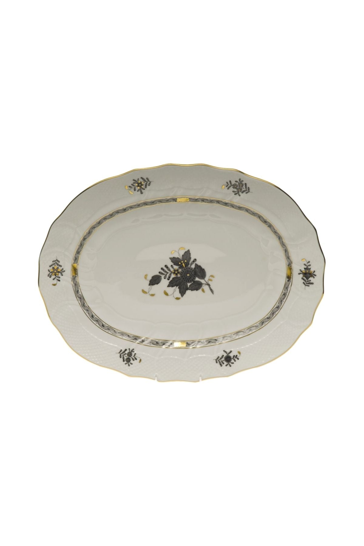 Five piece dinner service is hand painted on white porcelain including 24k accents. Black details.