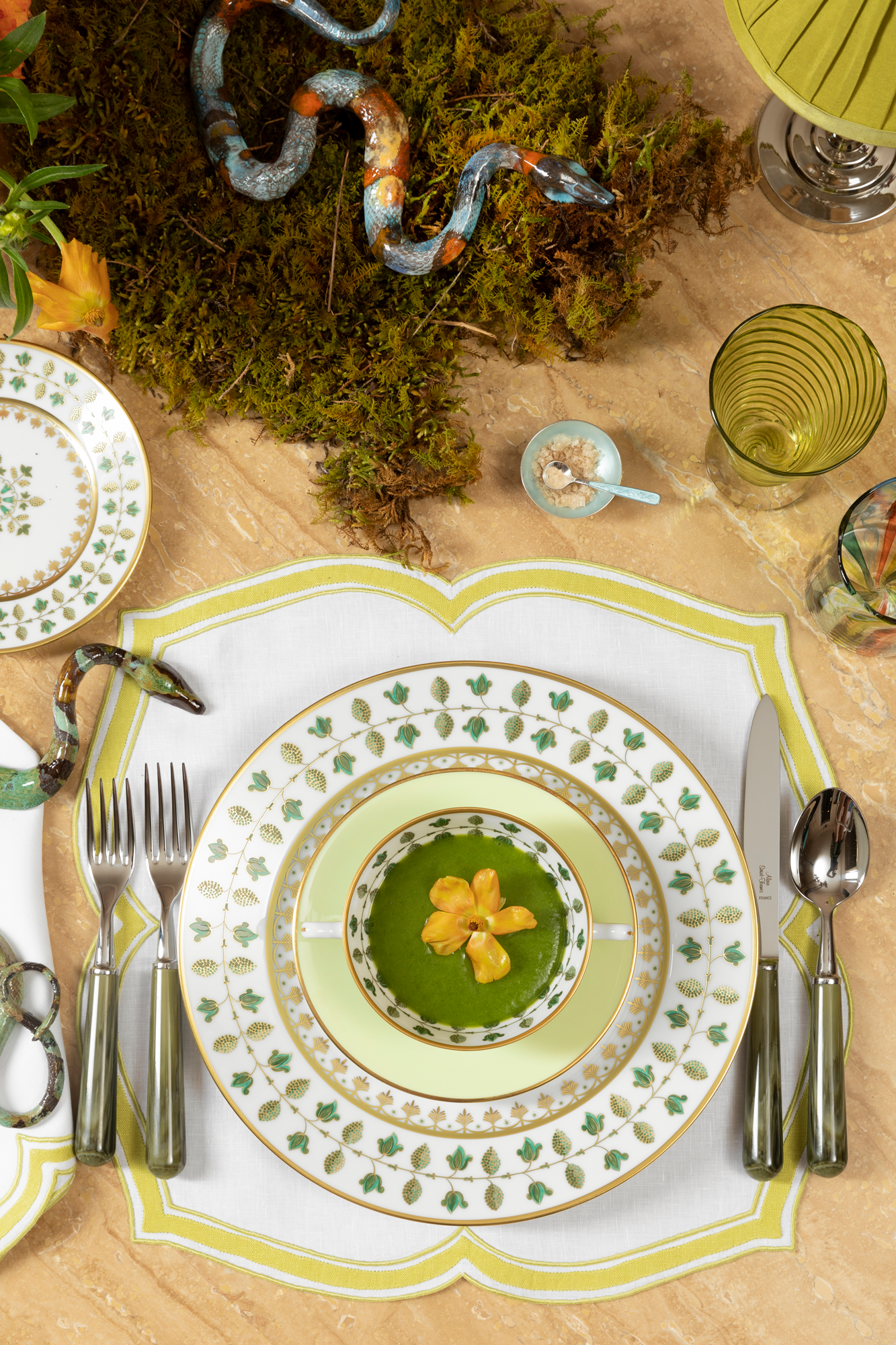 Linen dinner napkin in an unusual scalloped design with chartreuse embroidery and French stitch appliqué made in Madeira, Portugal.