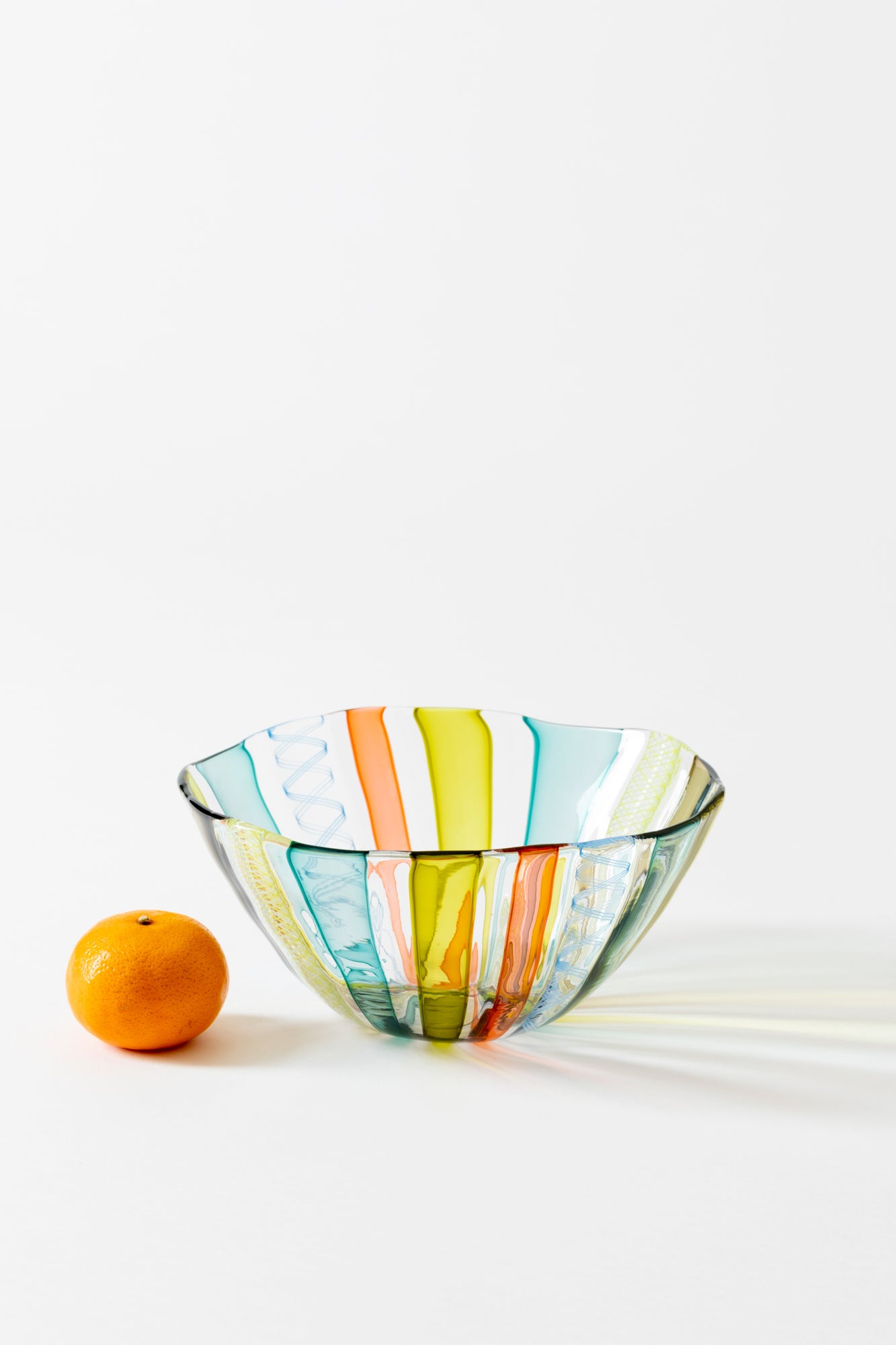 Latticino bowl handblown using twisted glass canes by Tracy Glover.