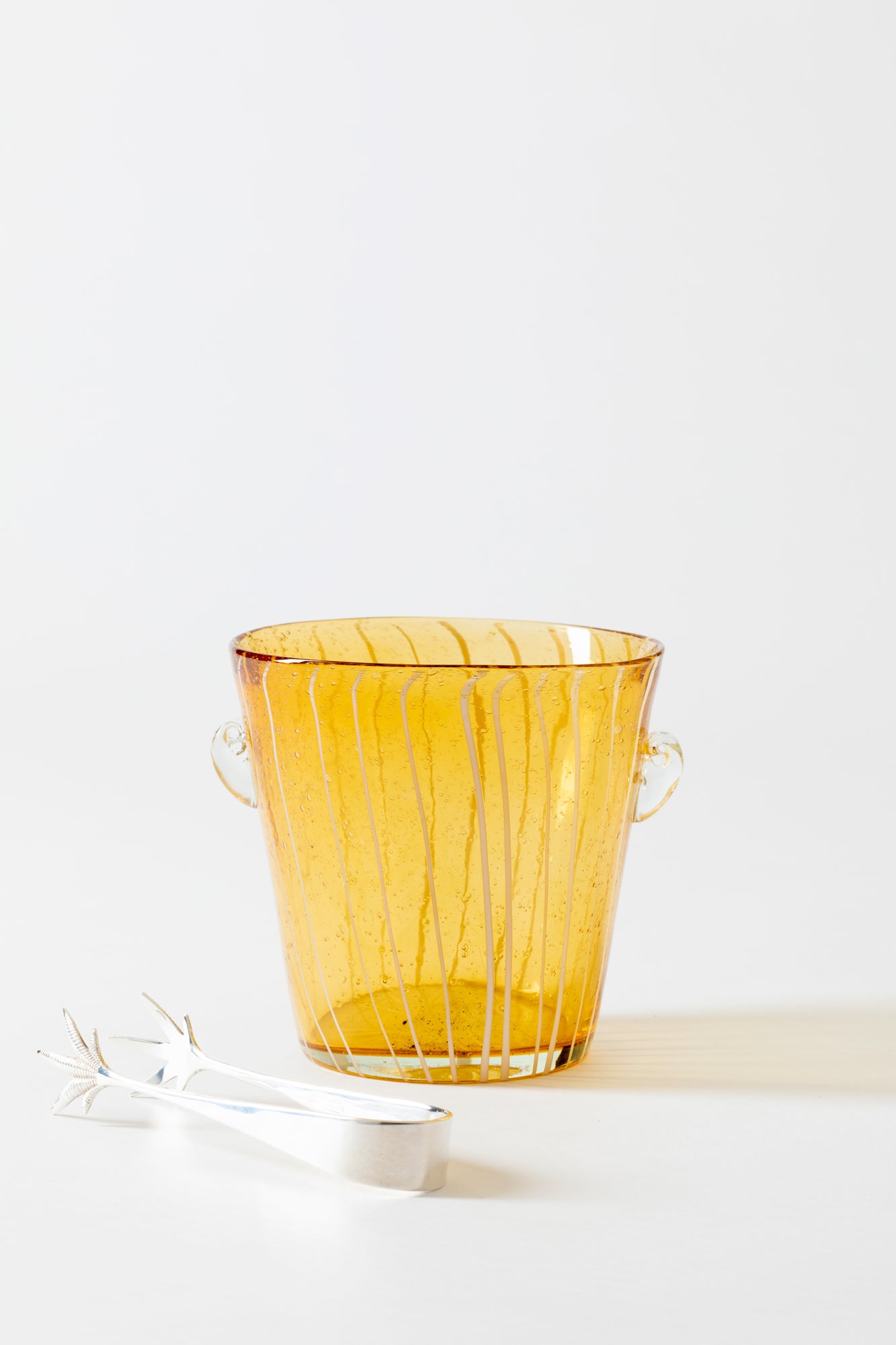 Vintage Murano yellow blown glass ice bucket and pair of silver ice tongs. 