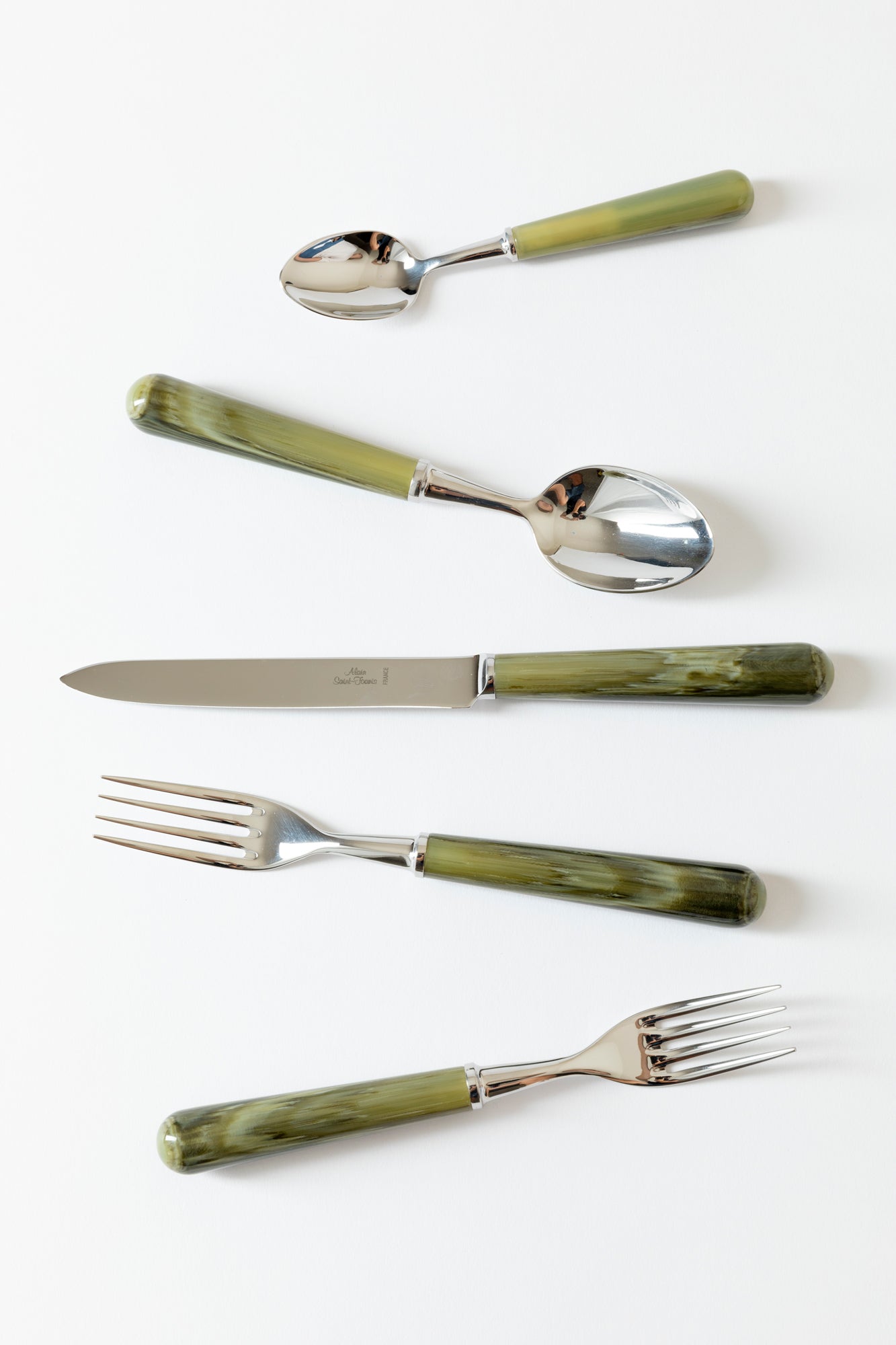 Green resin marbled flatware.