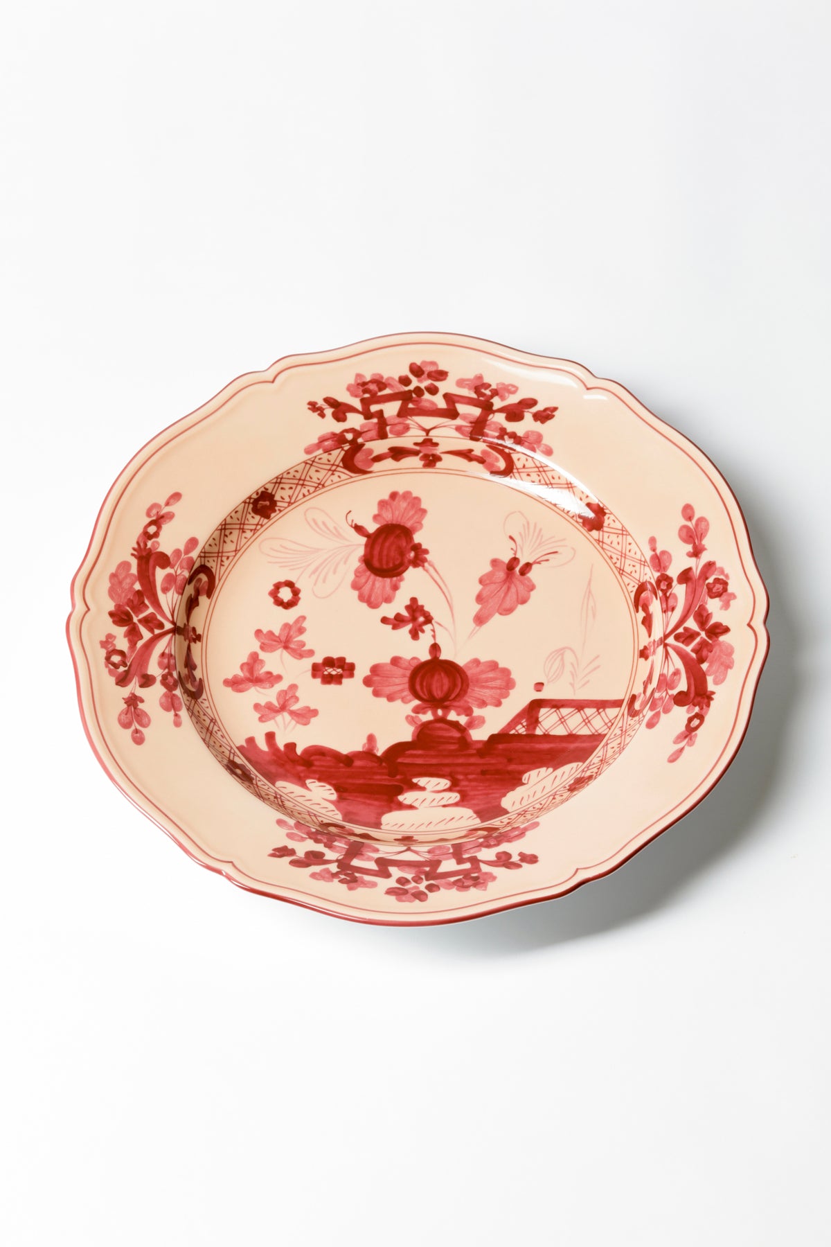This porcelain plate in Ginori’s traditional Antico Doccia shape is decorated with a stylized carnation reinterpreted by Gio Ponti in 1946. Handmade and decorated in Italy.