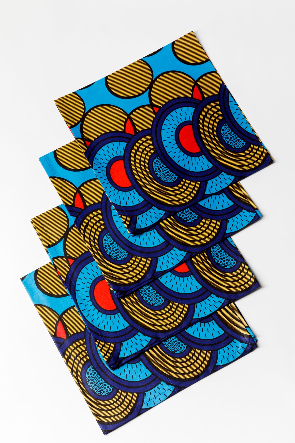Blue, green and red table linens were made by Ankara Company located in Johannesburg, South Africa.
