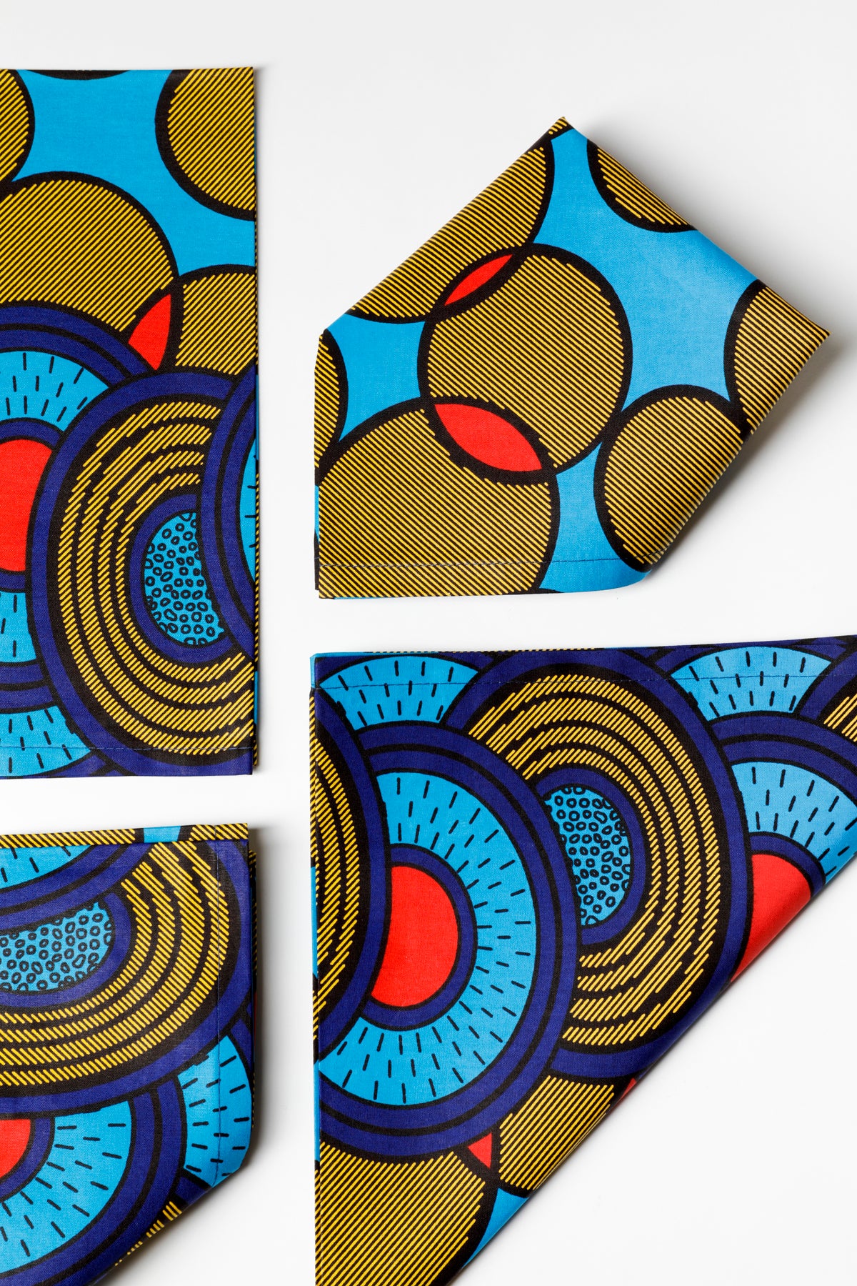 Blue, green and red table linens were made by Ankara Company located in Johannesburg, South Africa.