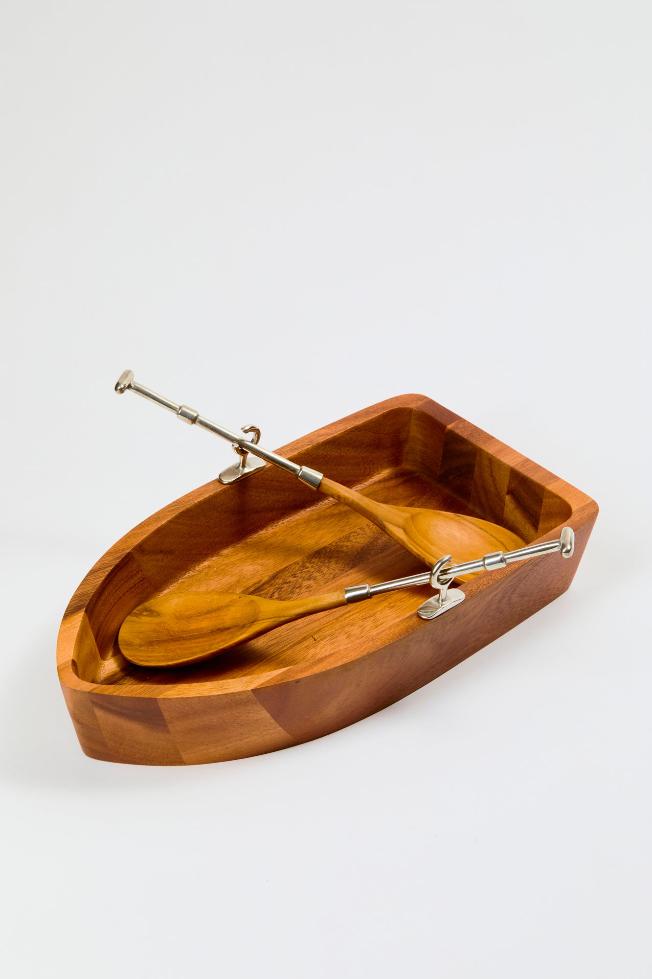 Salad boat is hand-crafted Acacia hardwood.