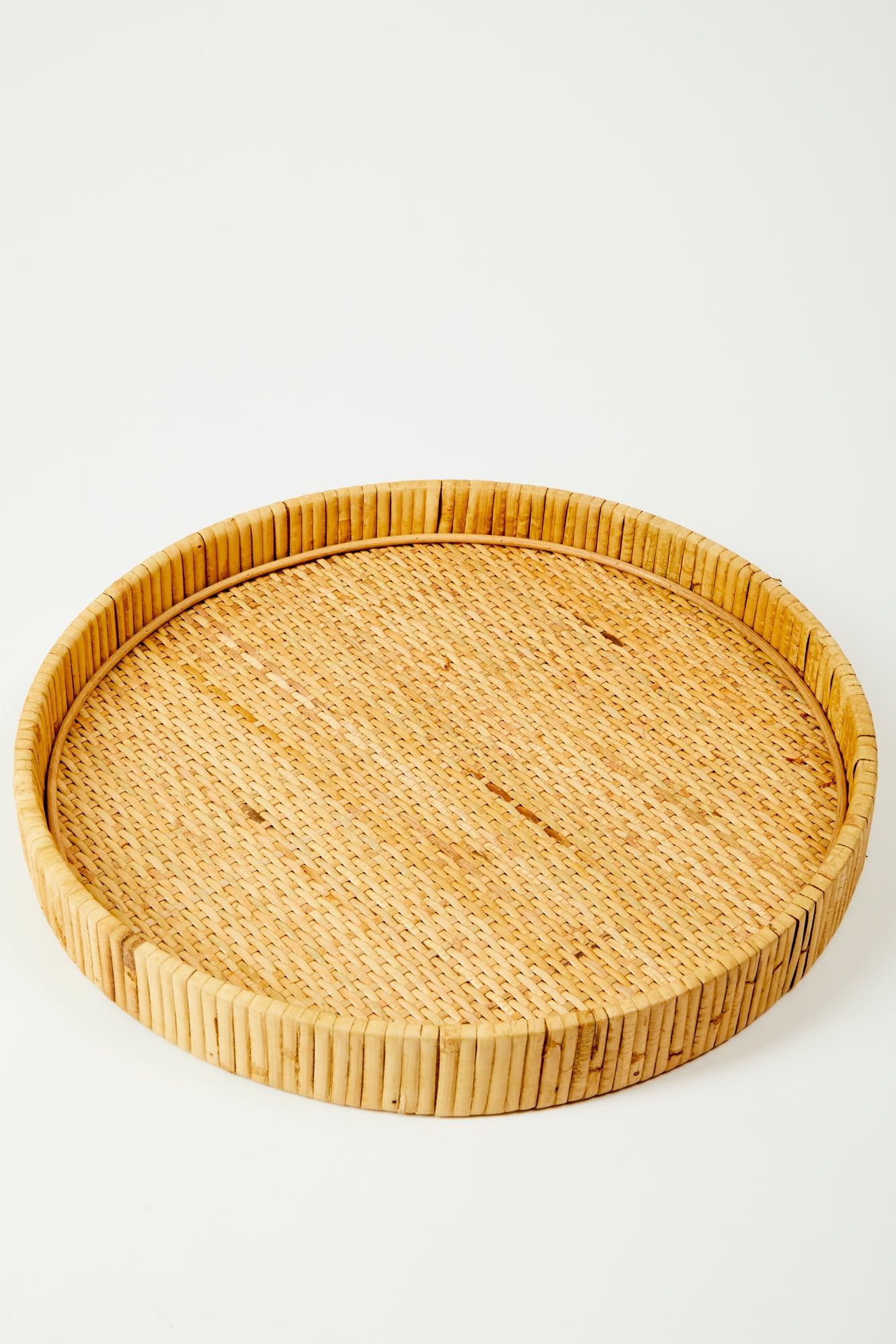 Round rattan passing tray.