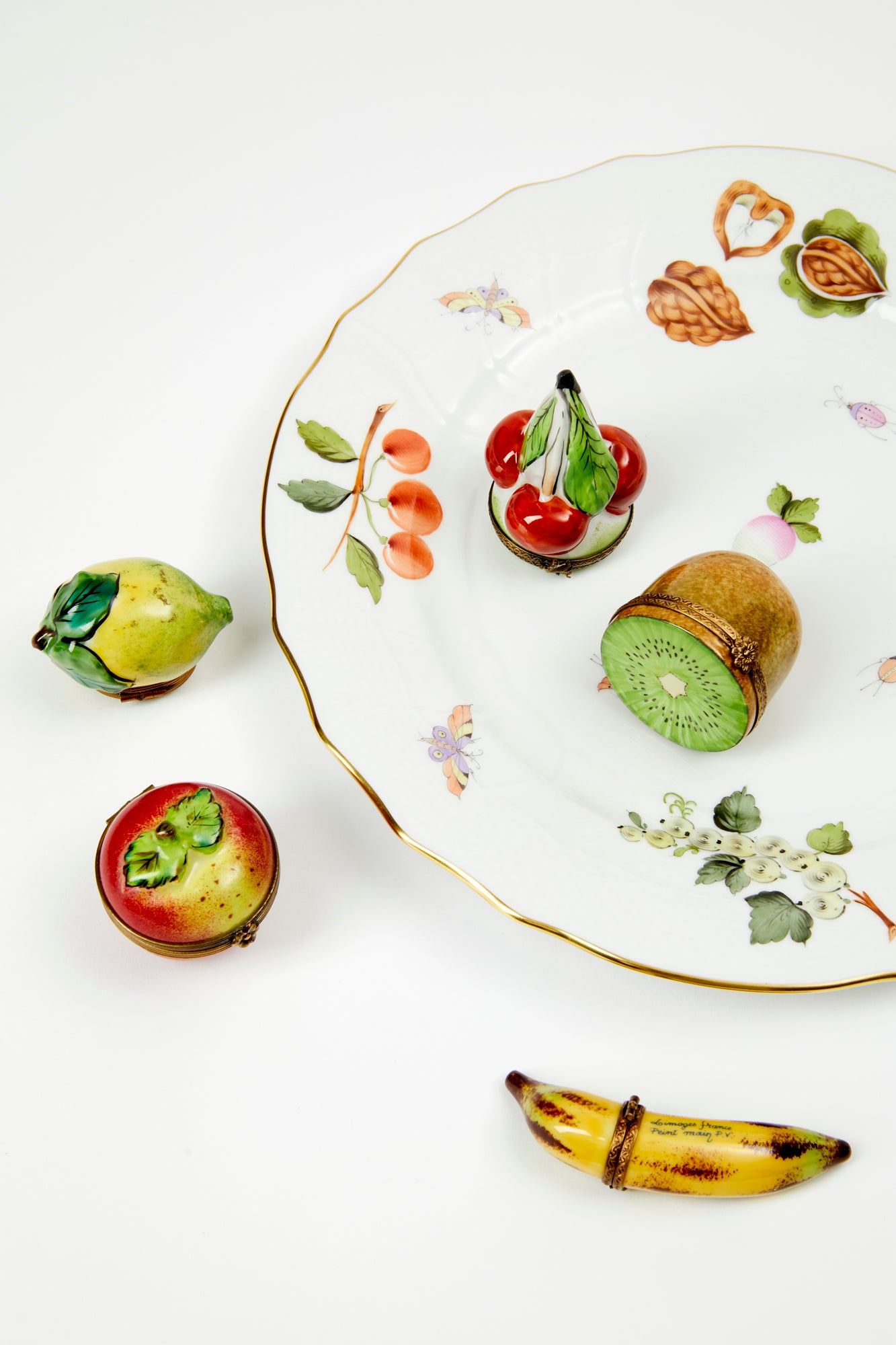 Fruit basket limoges boxes including a kiwi.