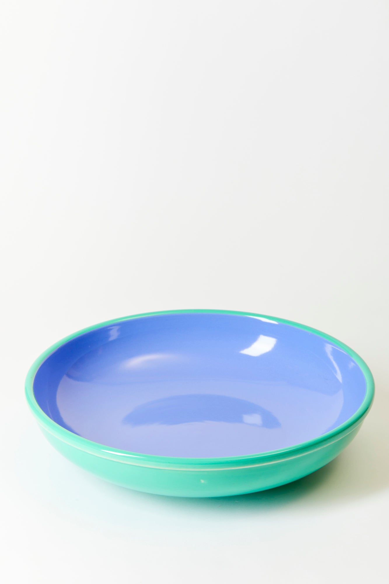 Two-tone dinnerware collection was designed in 1986, at the height of the Postmodern movement, led by the Memphis Group in Italy.