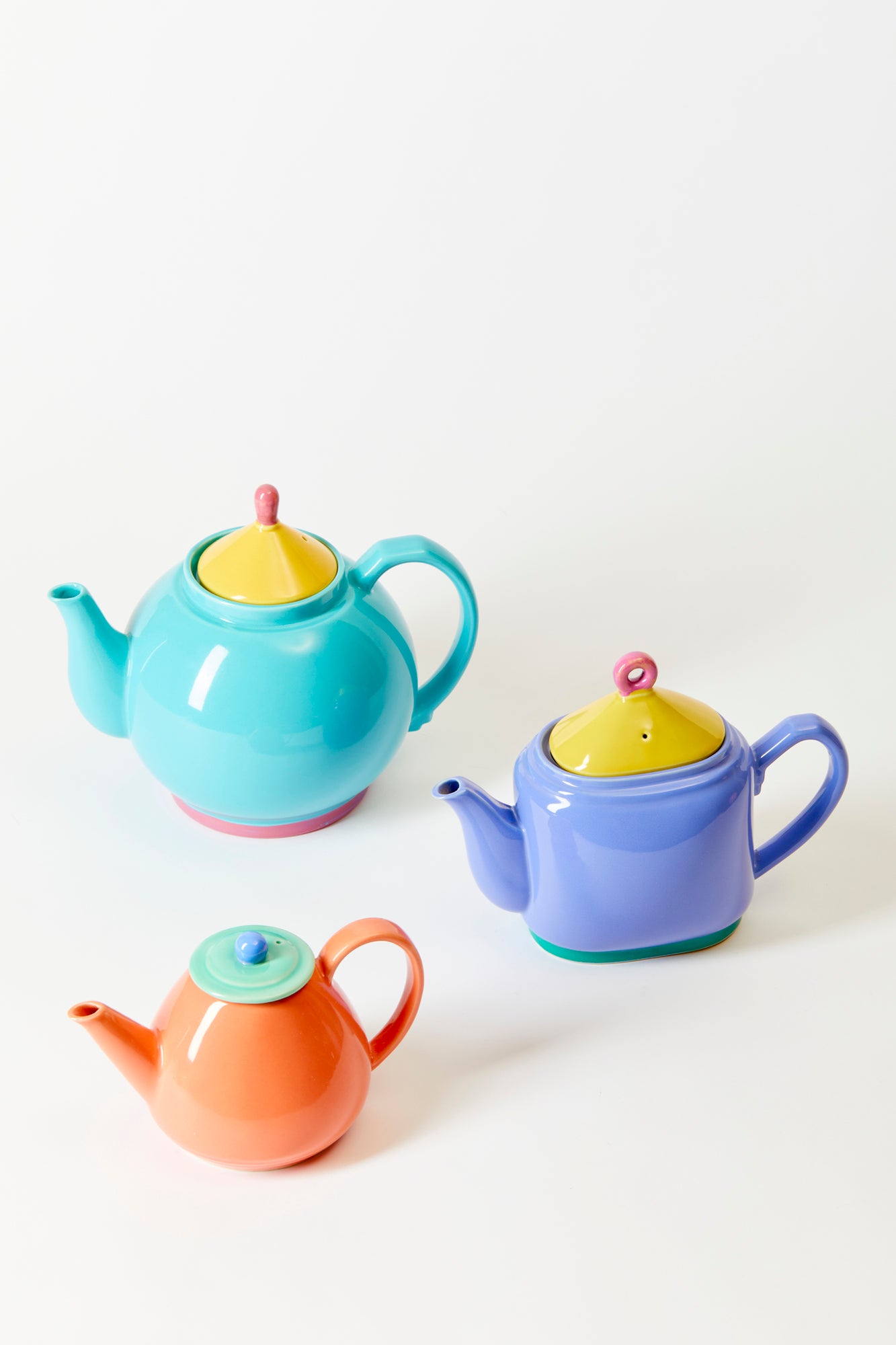 Colorful vintage pomo teapots.