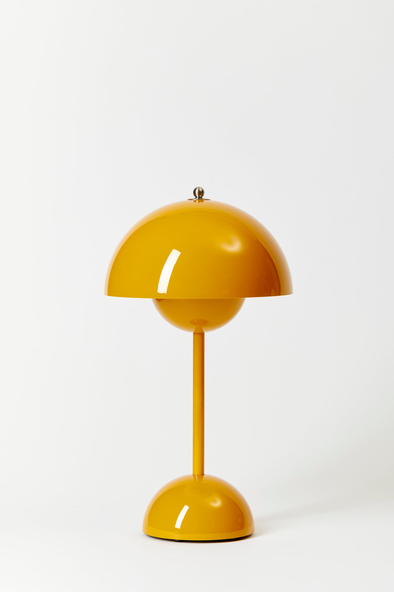 Danish designer Verner Panton’s 1968 mod design made portable lamp base in Mustard.