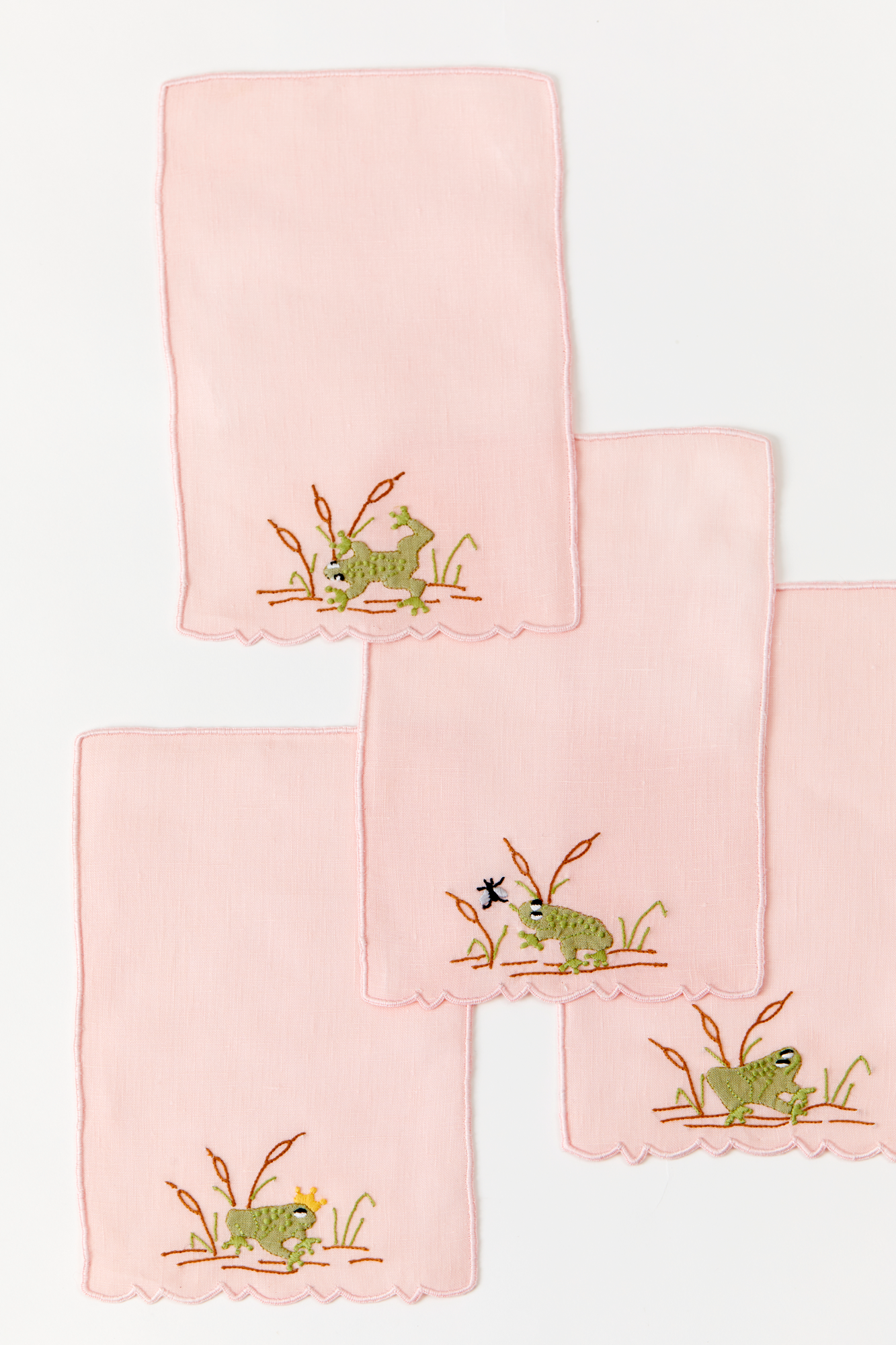 Frog in a pond cocktail napkins feature French stitch appliqué made in Madeira, Portugal.