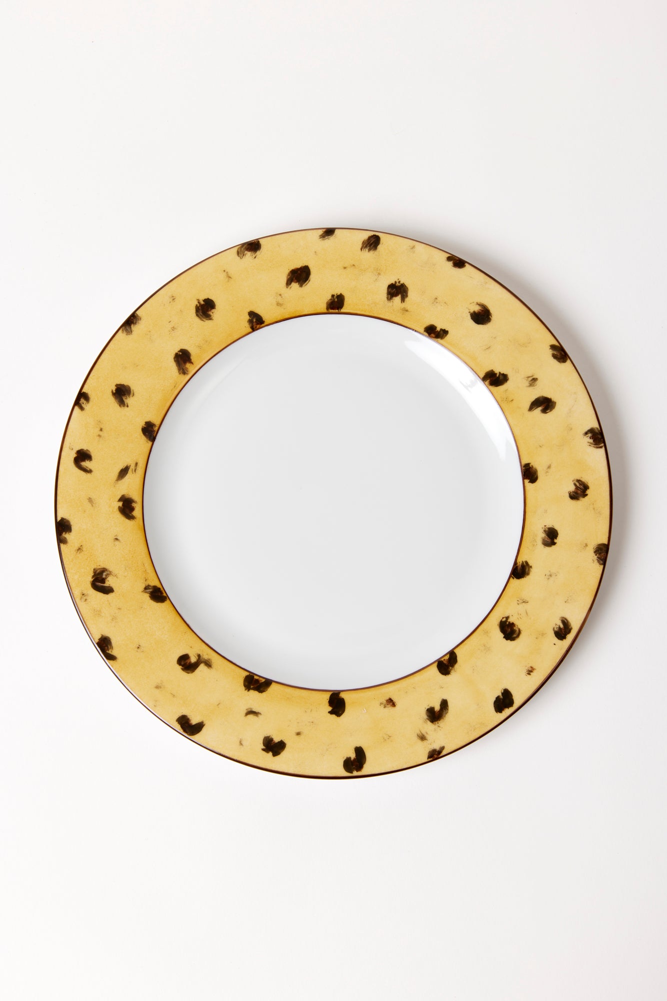 Hand-painted and traditionally crafted in an artisanal workshop in Arezzo, the spirited brushstrokes on this porcelain salad plate give a youthful twist to classic china.