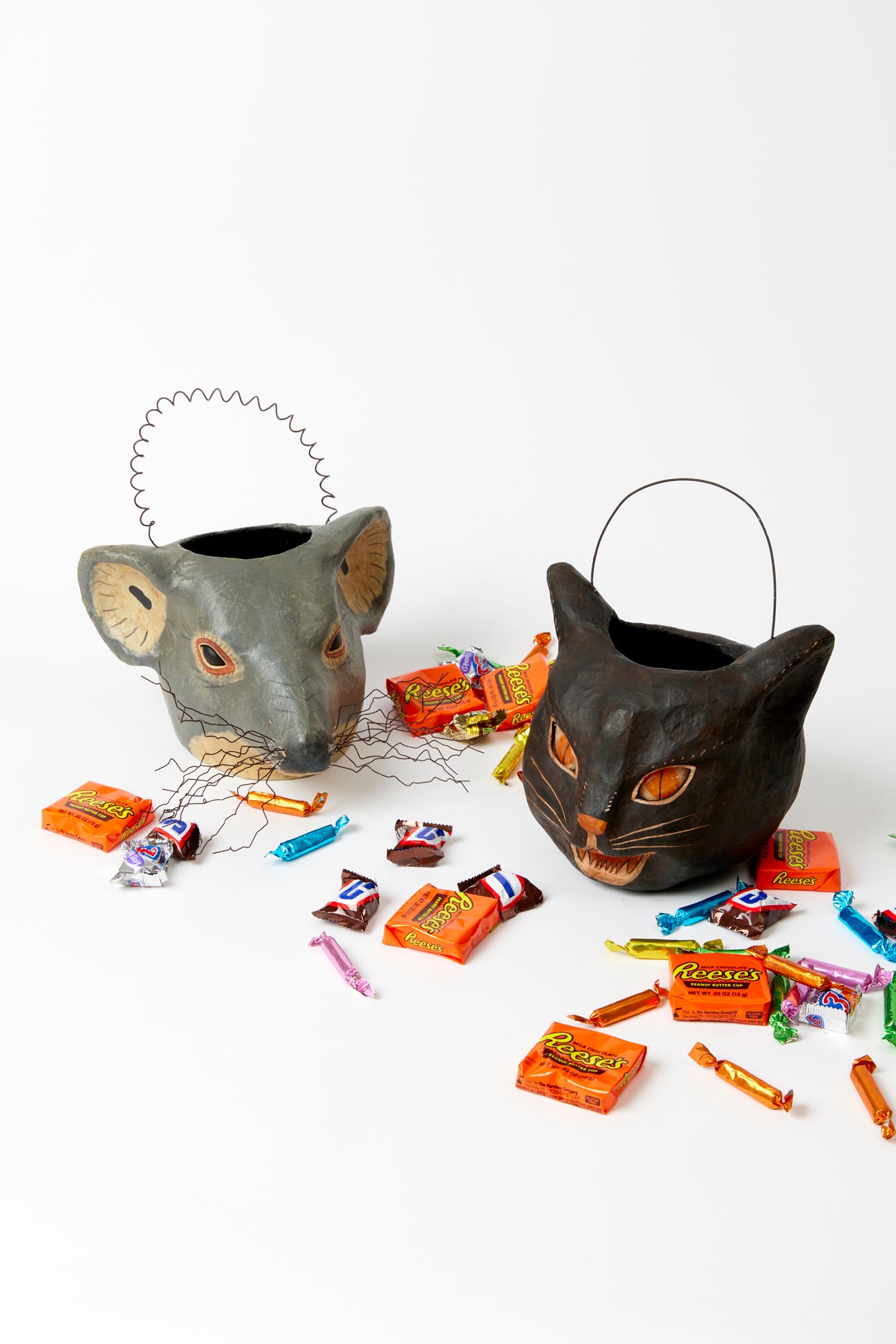 Two vintage-style candy buckets featuring classic cat and mouse designs, perfect for Halloween or festive gatherings. One bucket shows a black cat, while the other features a cute frazzled mouse, both adorned with spooky colors and artisan patterns.