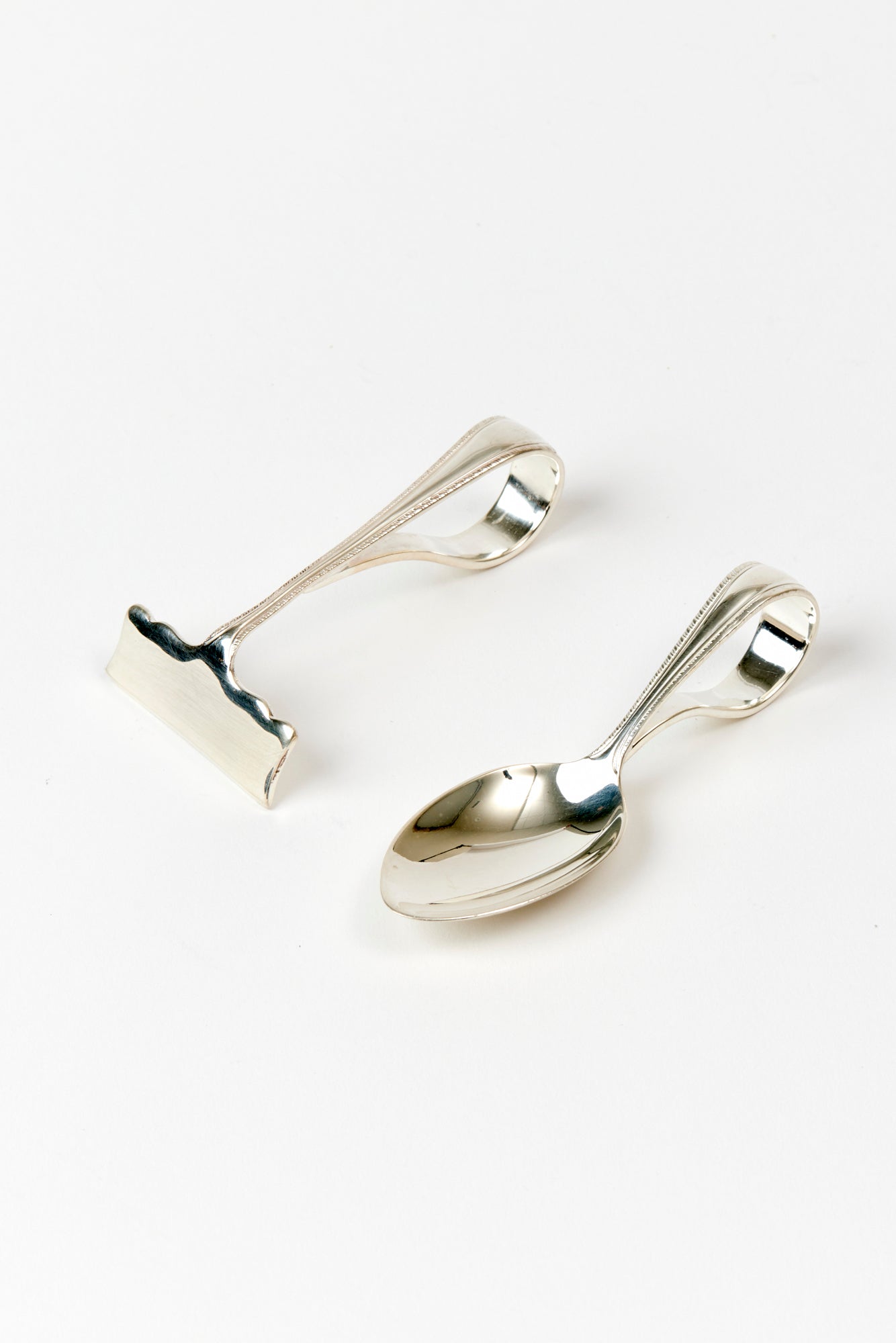 Sterling baby spoon and pusher.